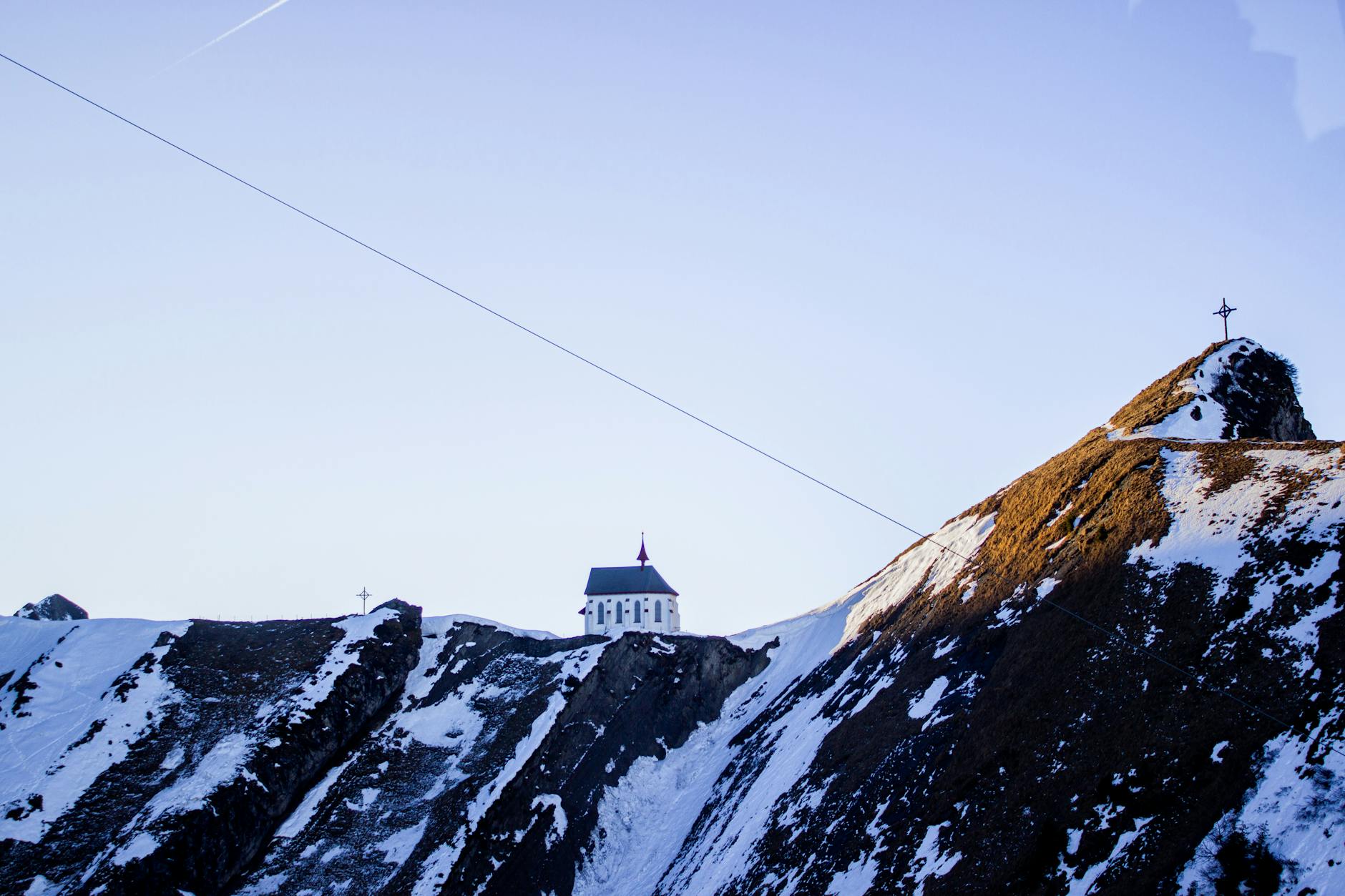 Snowy Pilatus chapel scene for pilgrimage arrival and timing planning.