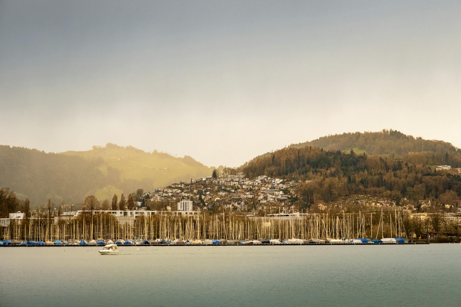Boats on Lake Lucerne with hills for repeat leisure planning.