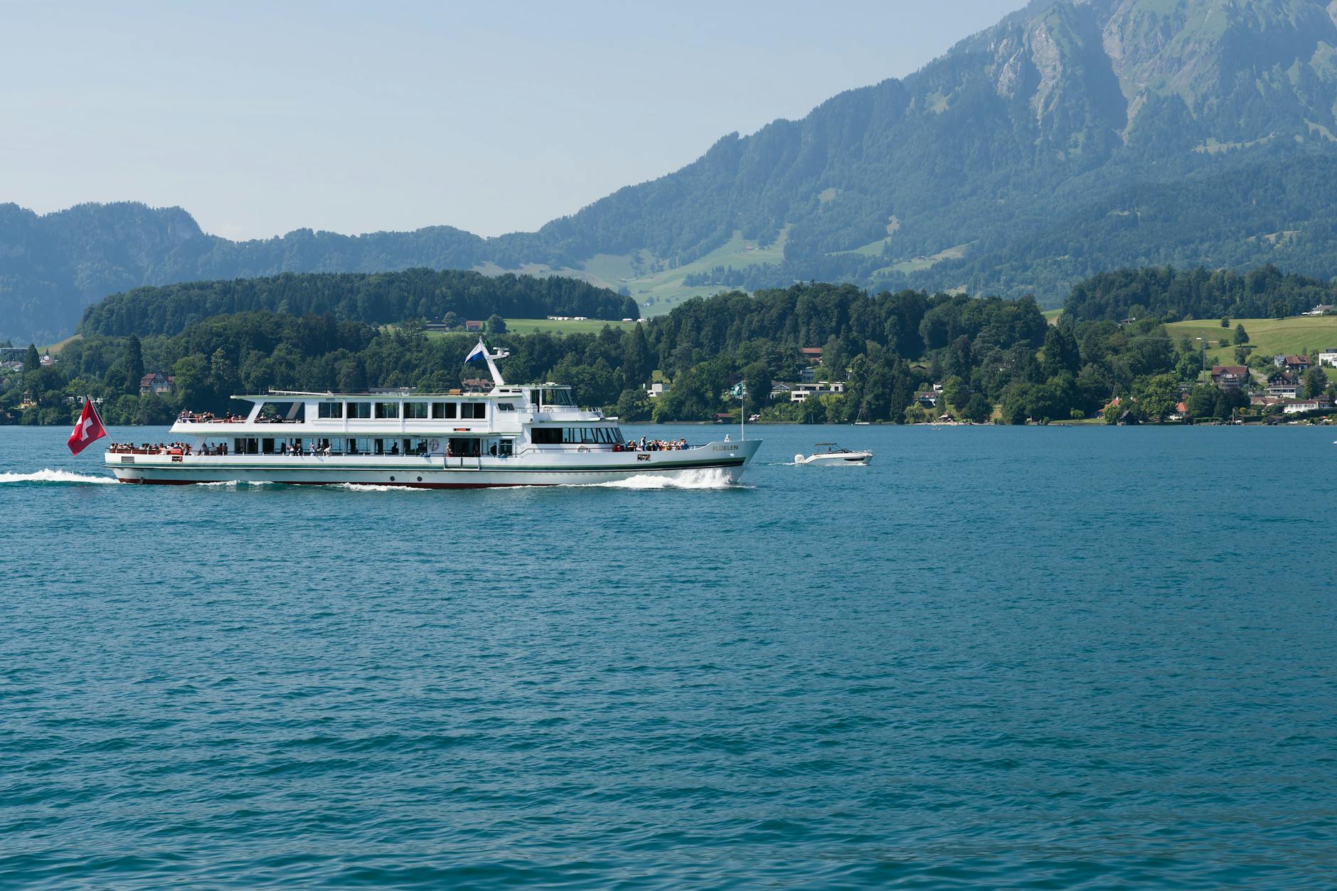 Passenger ferry on Lake Lucerne with Alps for repeat visitor departure timing.