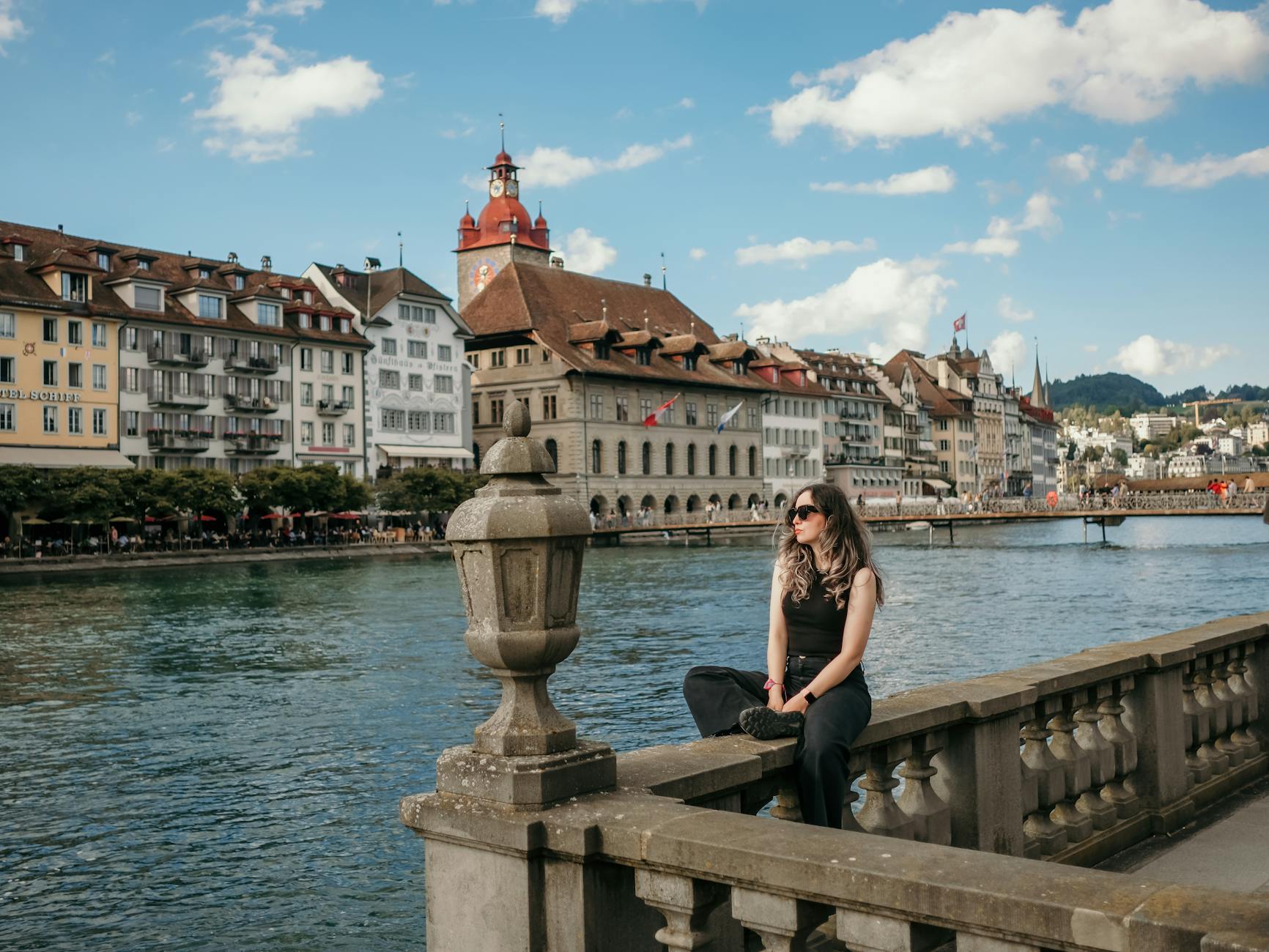 Traveler overlooking Lucerne waterfront for solo arrival planning.