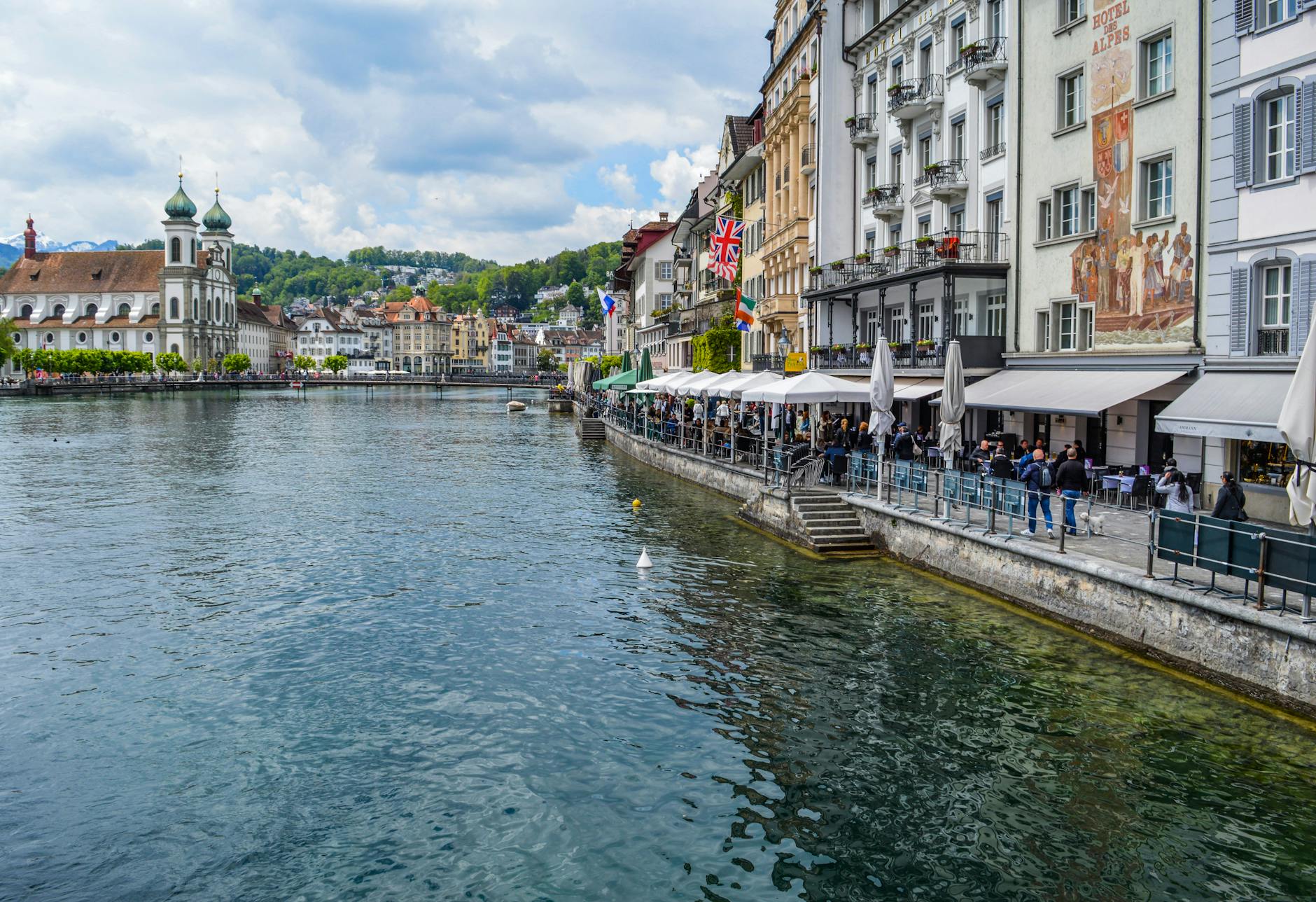 Lucerne river channel and colorful buildings for solo budget and route planning.