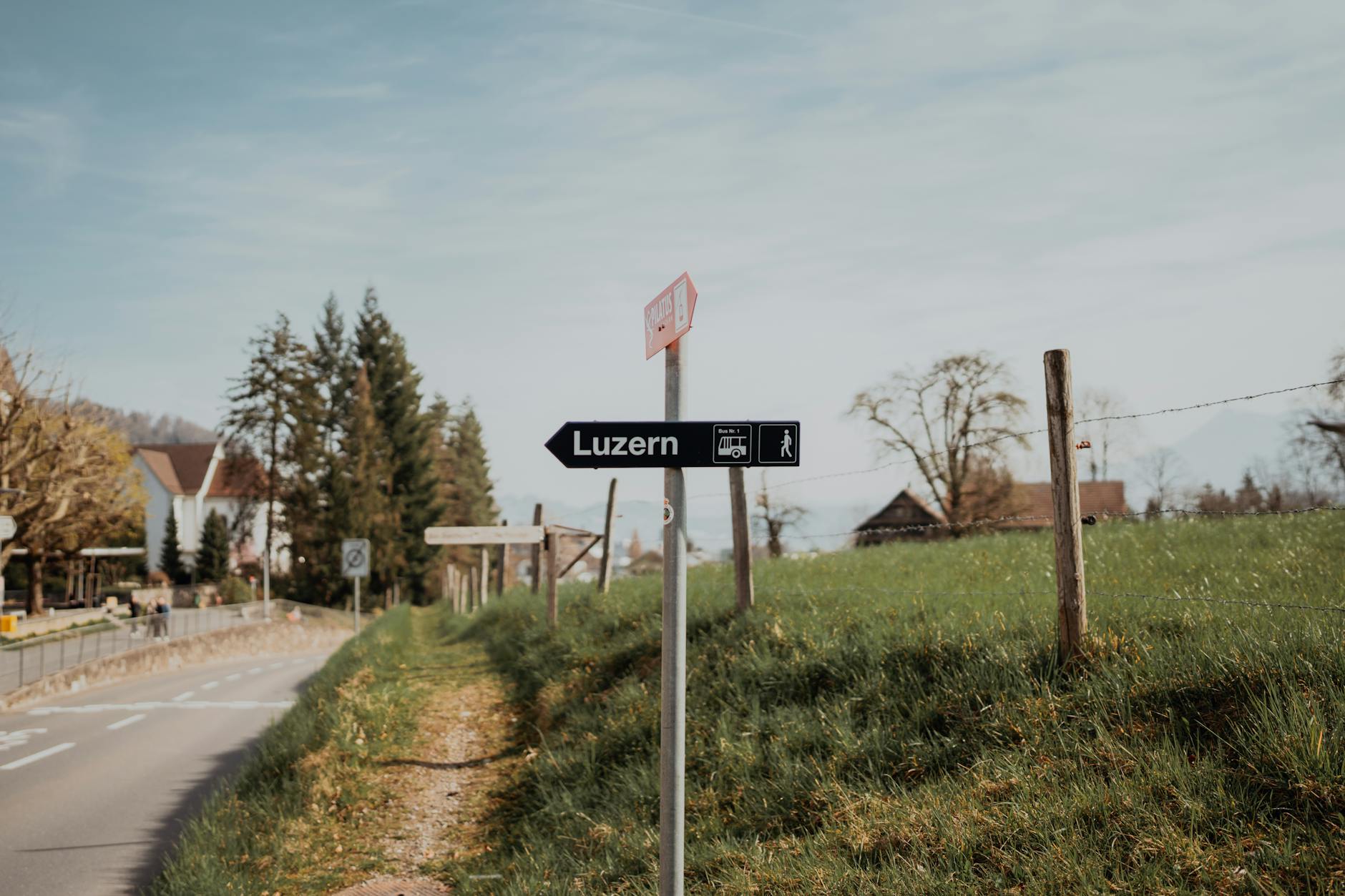 Road sign pointing to Lucerne for student arrival planning.
