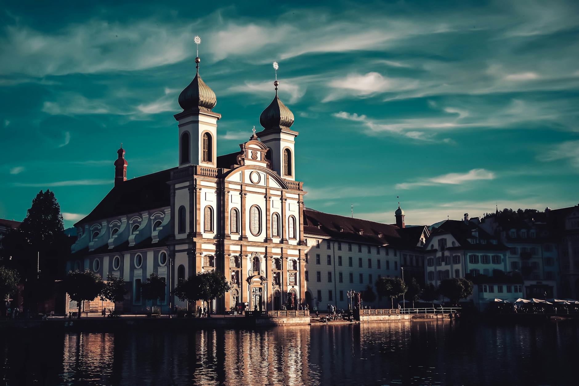 Jesuit Church beside the Reuss River for Lucerne tourist report planning.