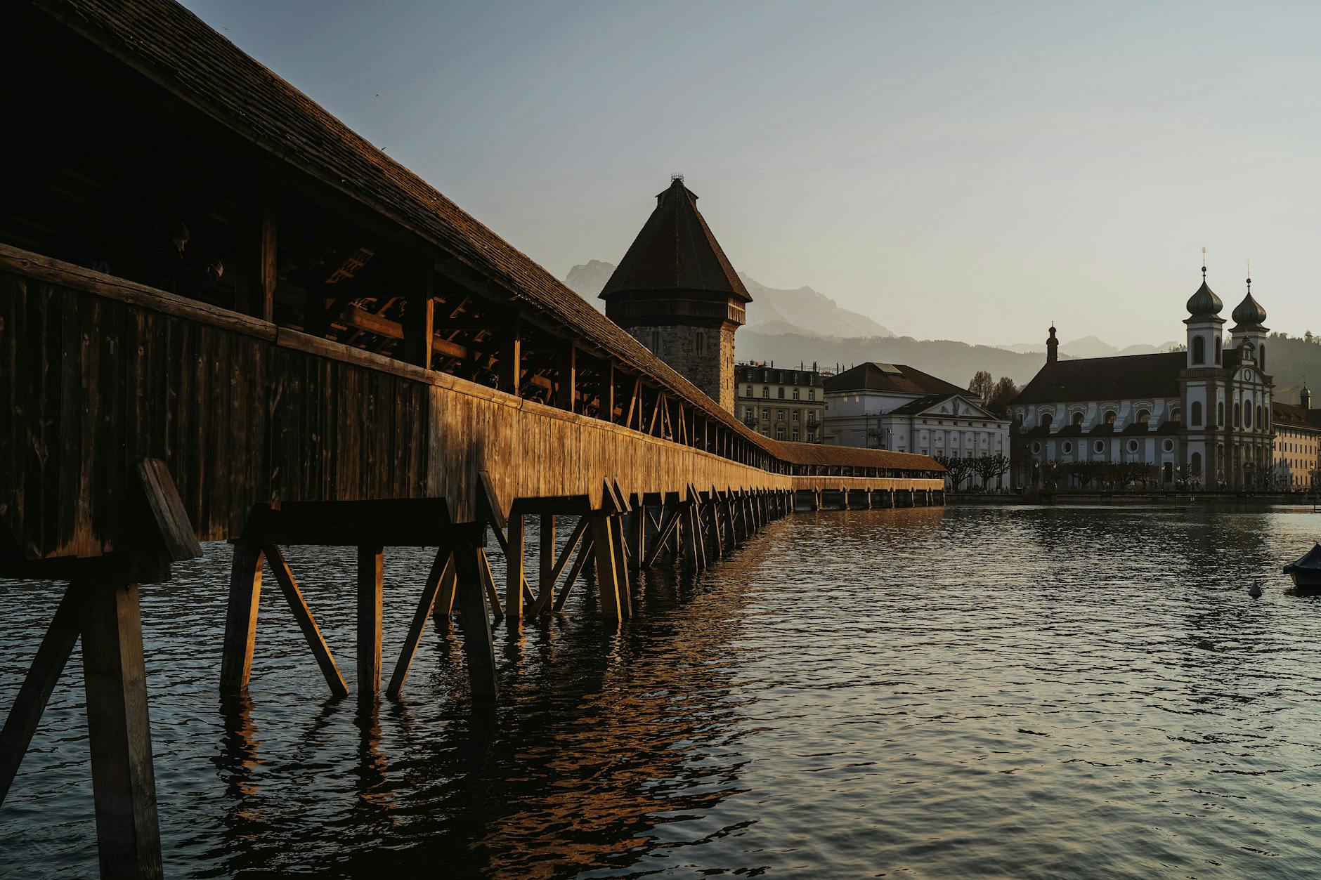 Chapel Bridge and Water Tower at sunset for Lucerne arrival orientation.