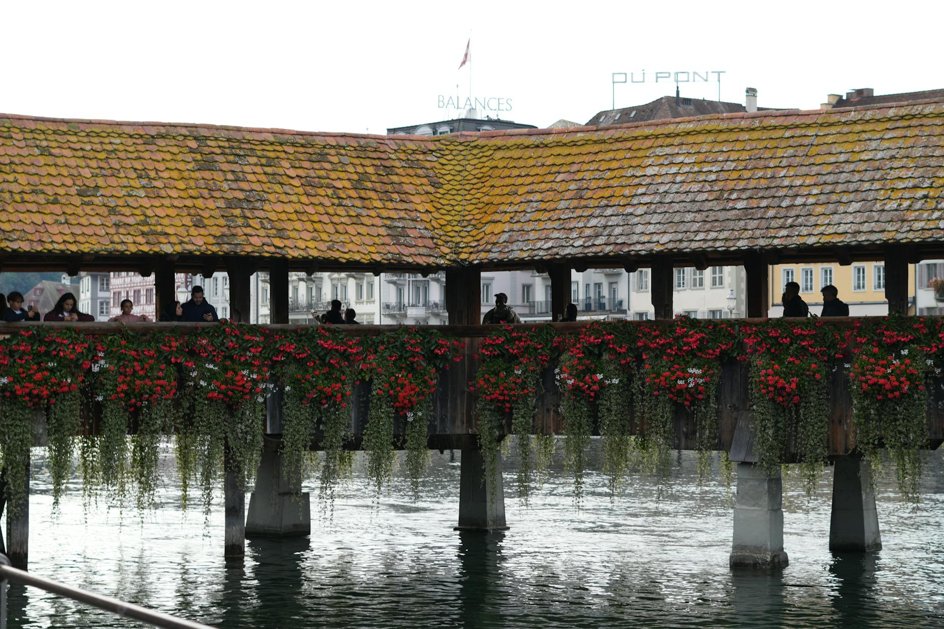 Chapel Bridge over the Reuss River in Lucerne for tourist trip planning.