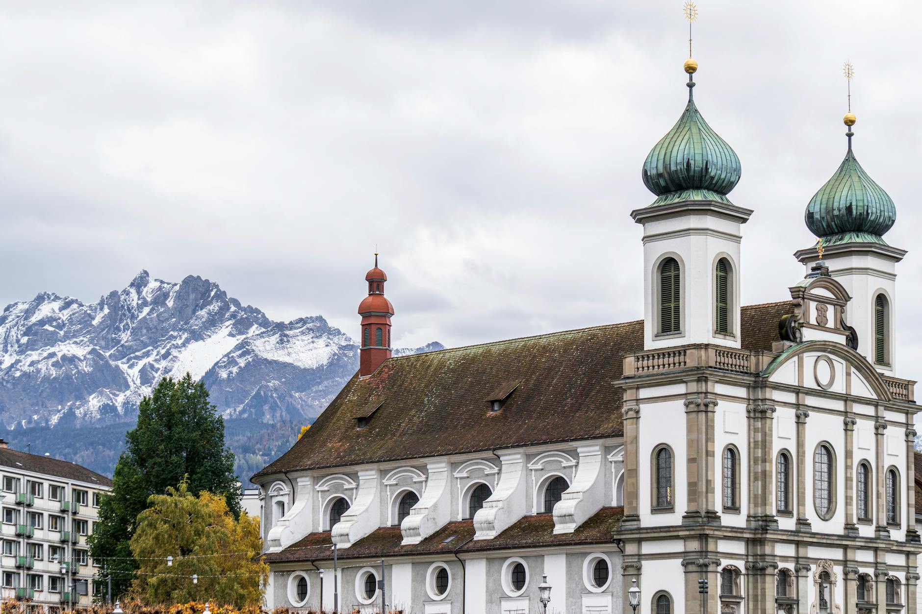 Jesuit Church and mountains in Lucerne for trade-show networking route planning.