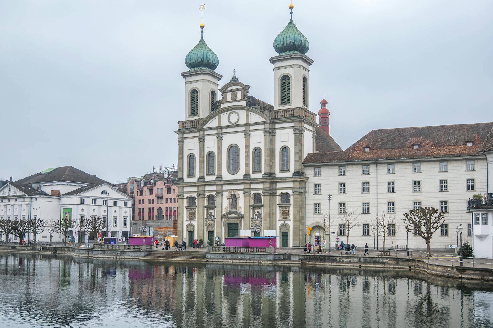 Jesuit Church beside the Reuss in Lucerne for medical-aware travel report planning.