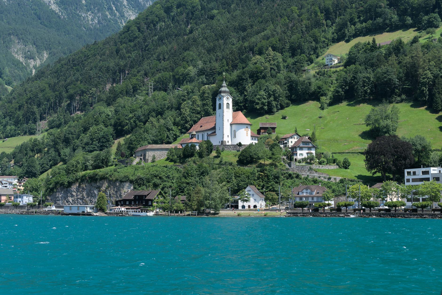 Fluelen church and Lake Lucerne landscape for NGO document and regional planning.