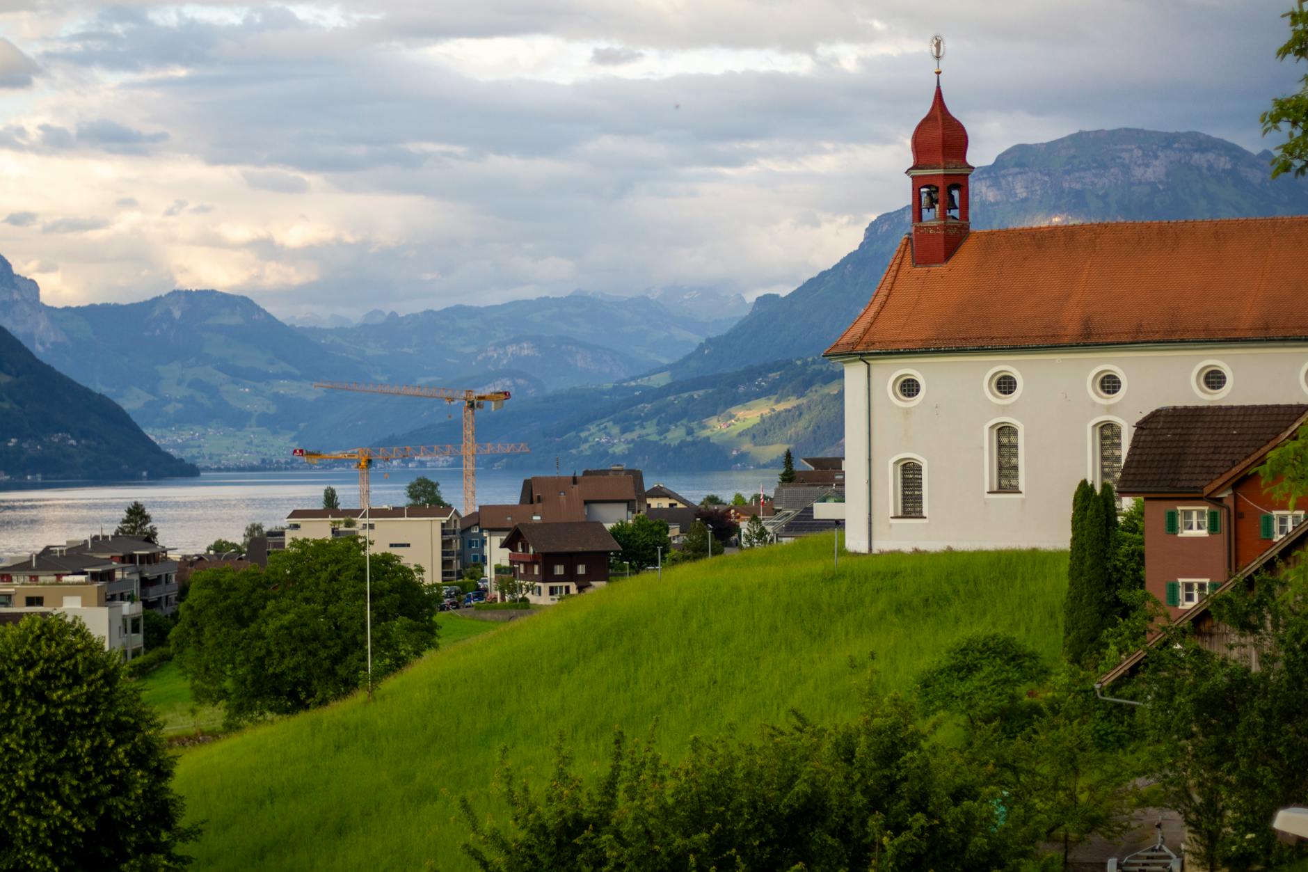 Church above Lake Lucerne for volunteer and NGO travel report planning.