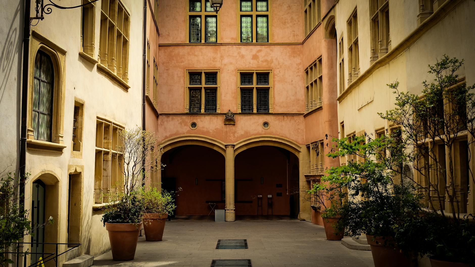 Historic courtyard with arches in Lyon