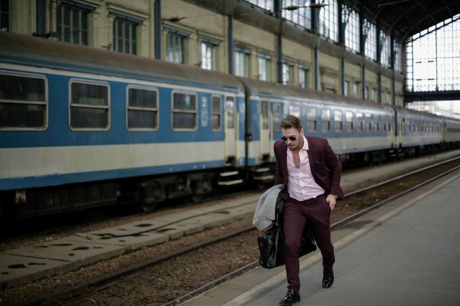 Business traveler moving quickly through a rail station