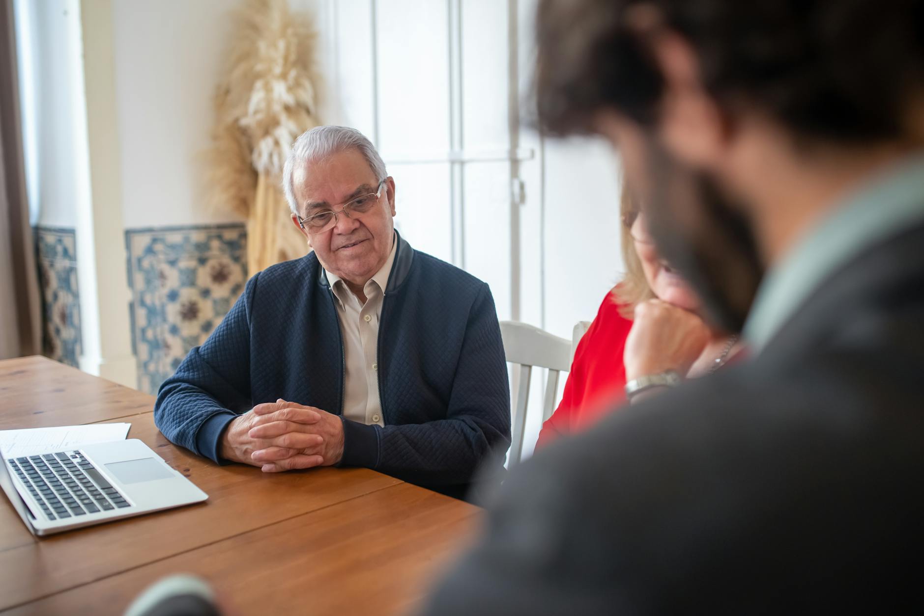 Consultant meeting with clients in an office