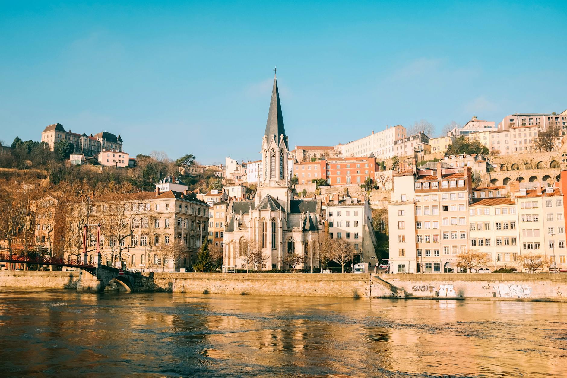 Historic Lyon church and riverfront buildings