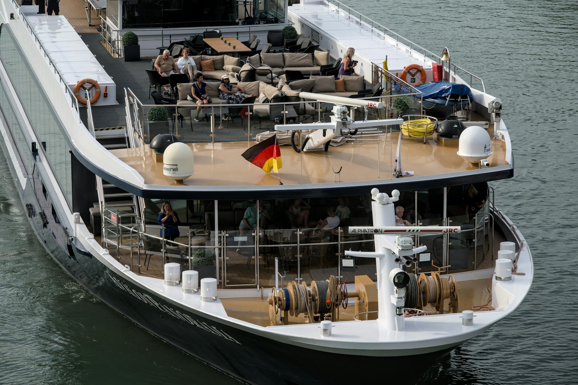 Passengers on the upper deck of a river cruise ship