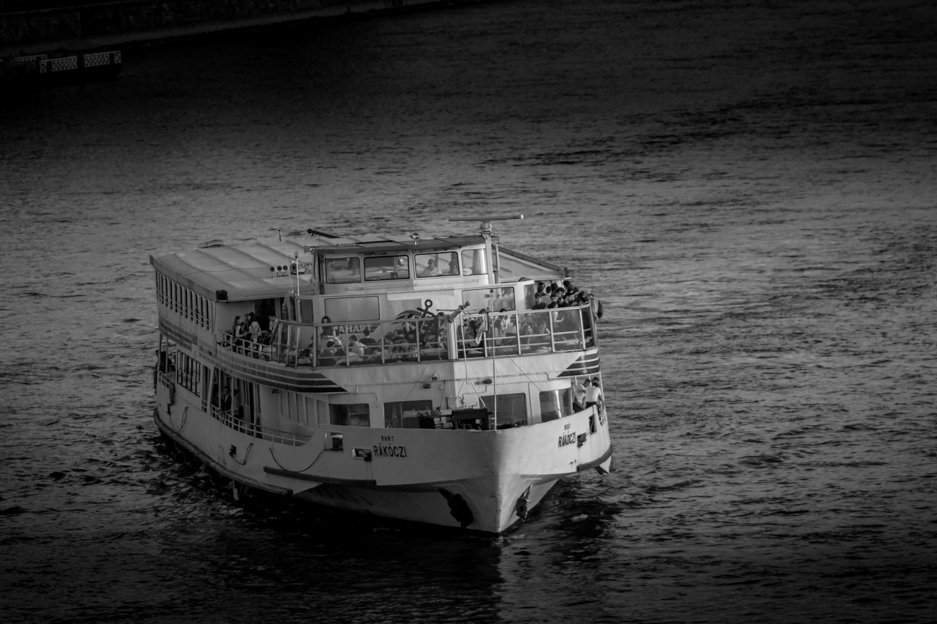 Passengers enjoying a riverboat sightseeing cruise