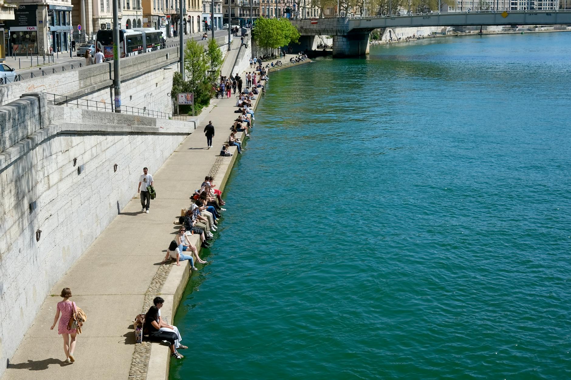 People gathered by the Rhone River in Lyon