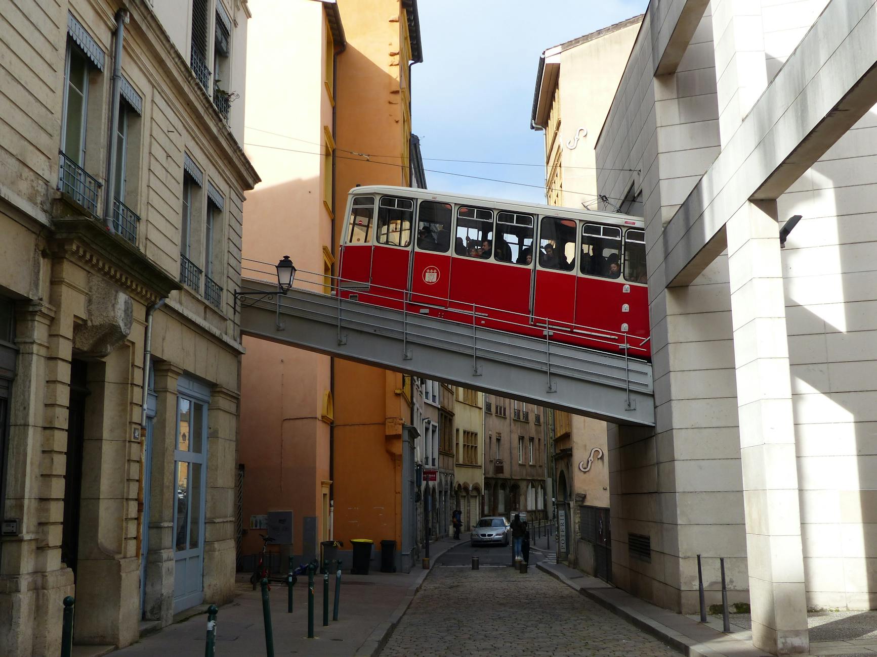 Red cable car in Lyon's old district
