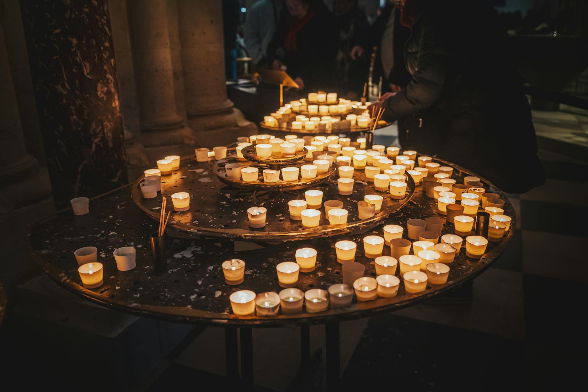 Votive candles glowing in a church