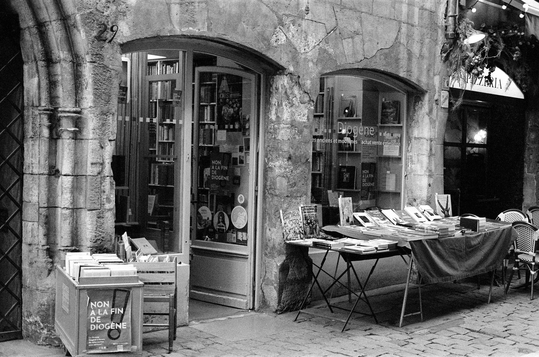 Vintage bookshop on a cobblestone street in Lyon