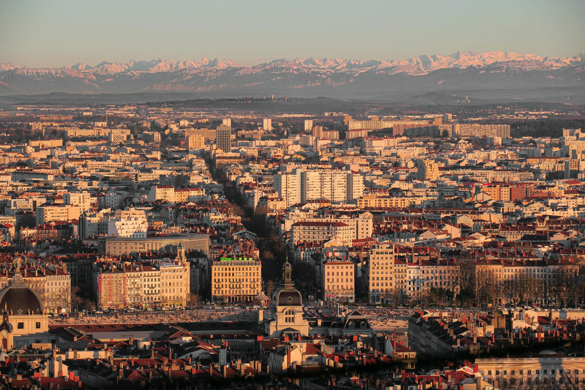 Aerial view of Lyon's cityscape and surrounding hills