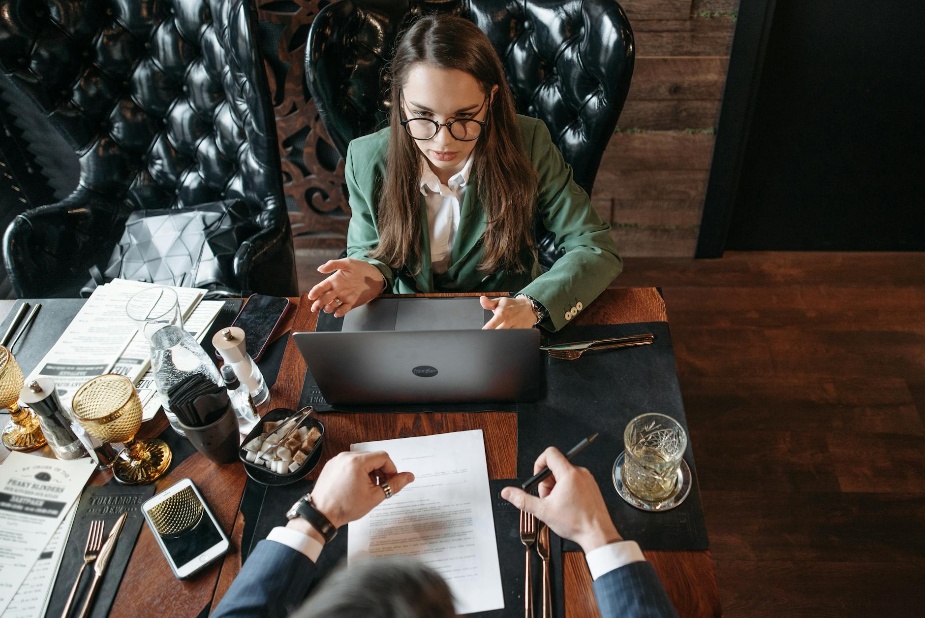 Business meeting at a restaurant table