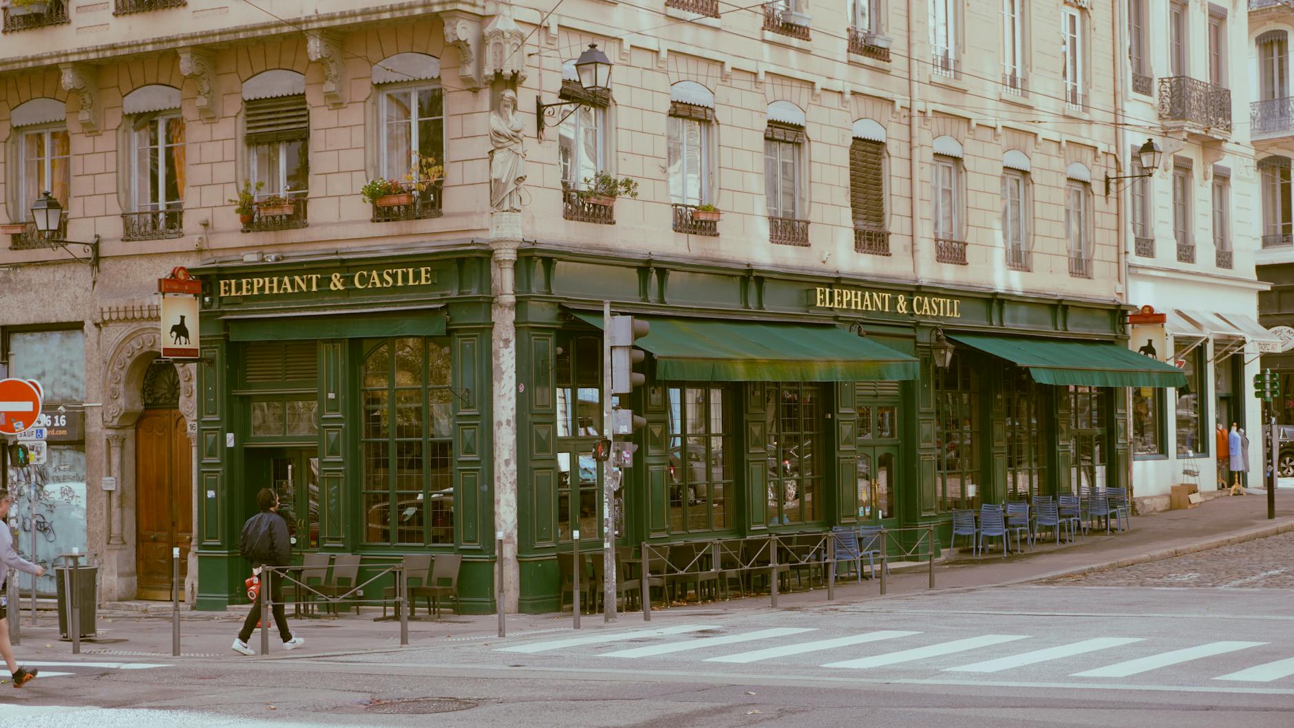 Vintage pub facade on a street corner in Lyon