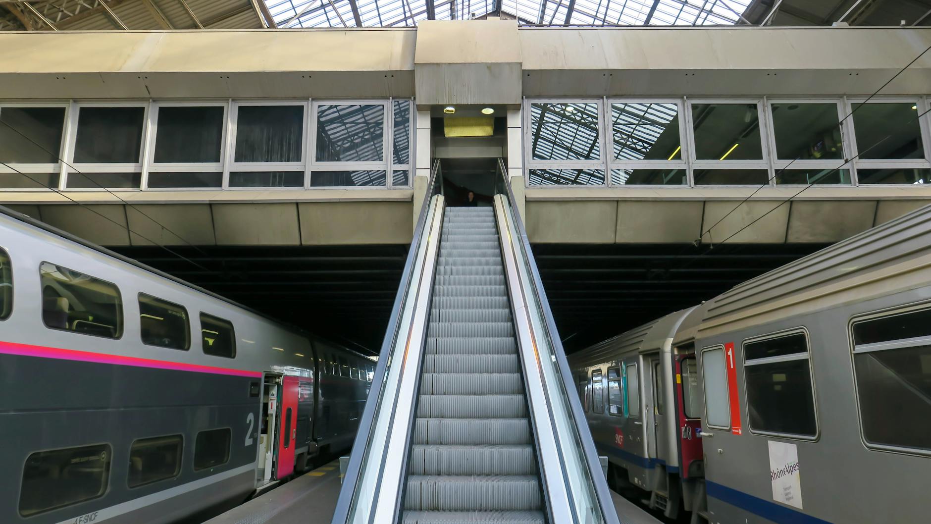 Escalator leading to platforms in a Lyon train station