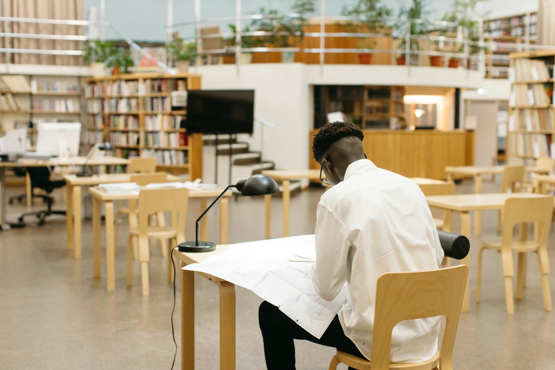 Student studying in a modern library