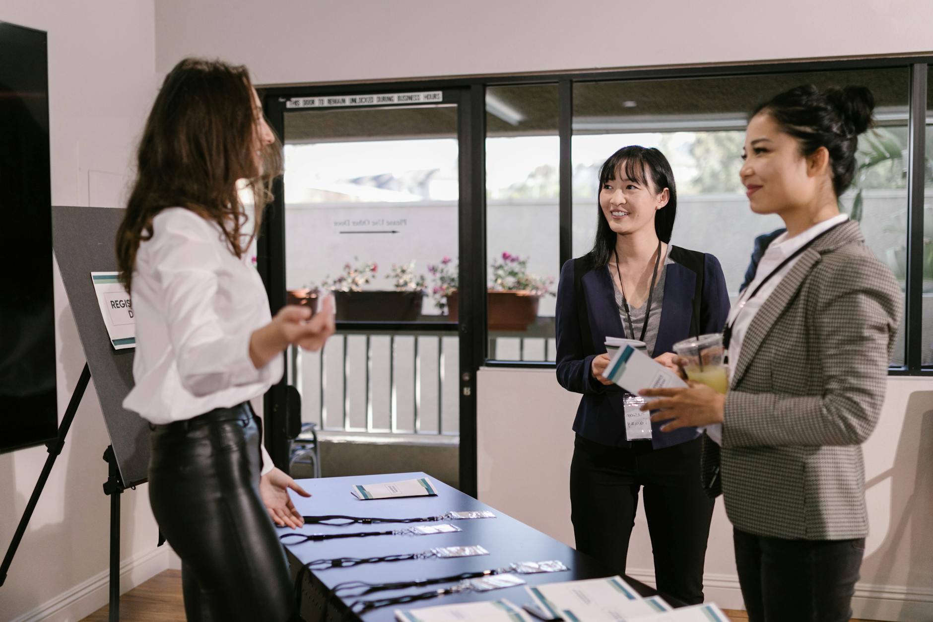 Business travelers registering at a conference desk