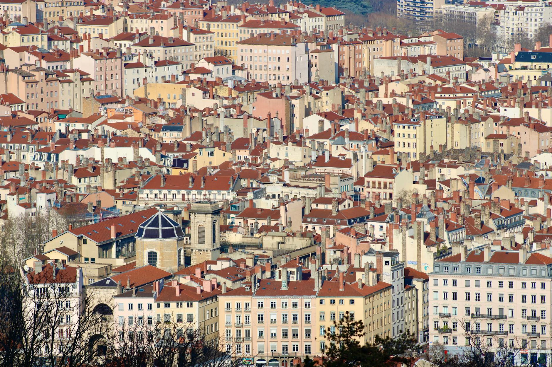 Aerial view of Lyon rooftops and dense urban neighborhoods