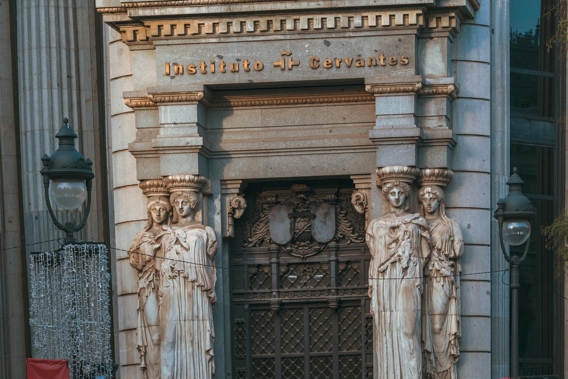 Instituto Cervantes entrance with classical sculptures in Madrid