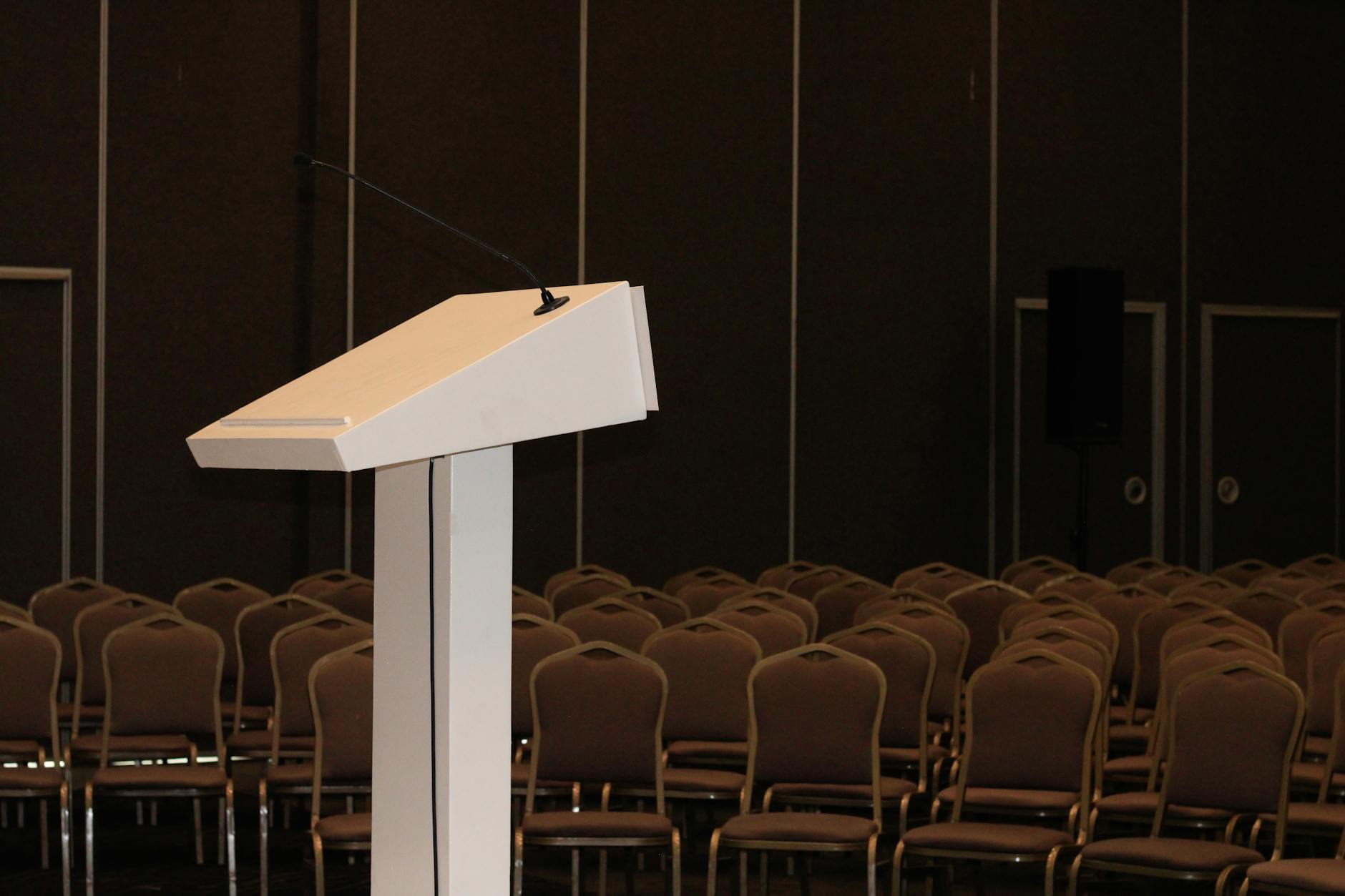 Conference room with podium and rows of chairs