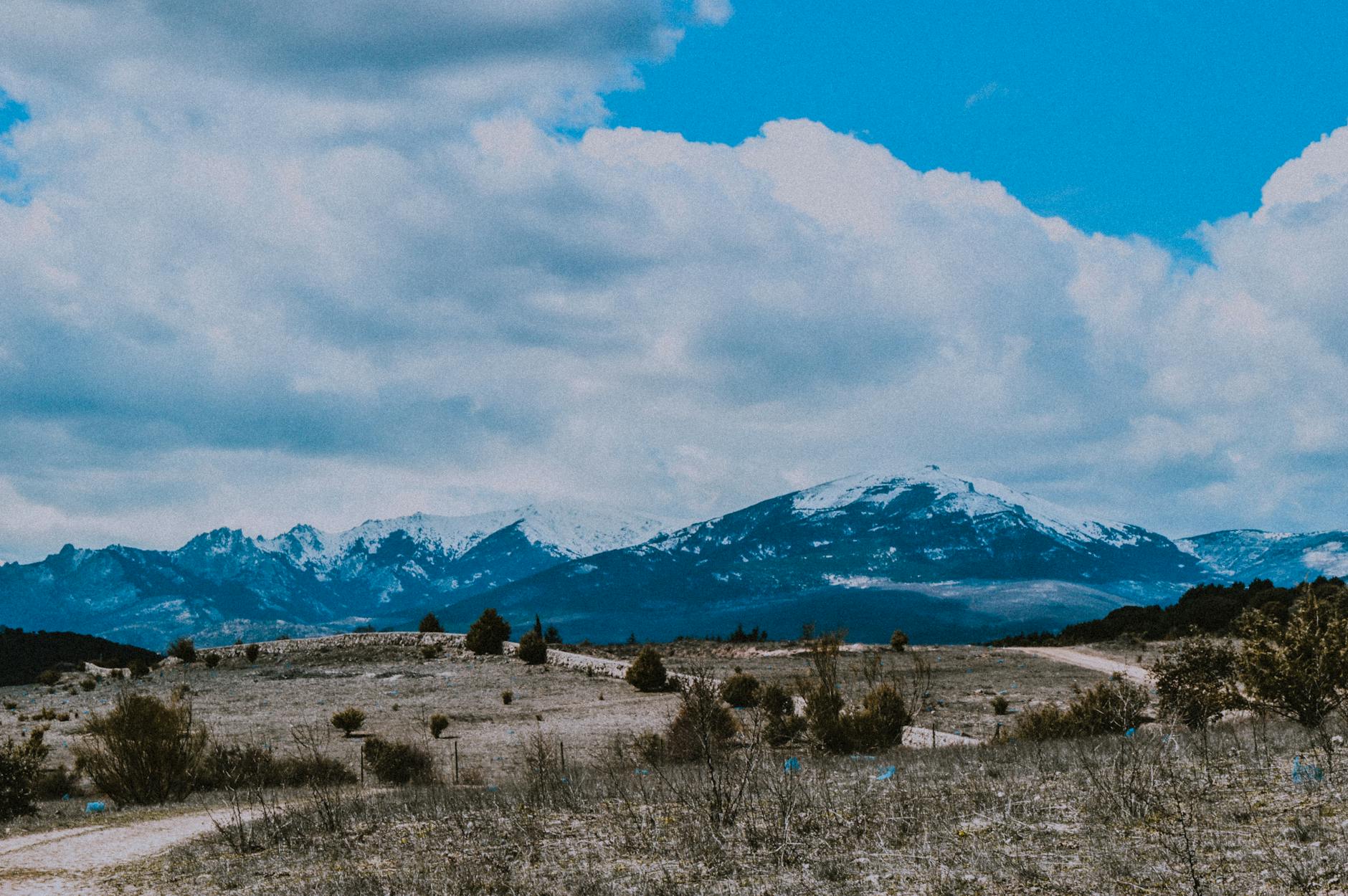 Snow-capped mountains near Madrid under a blue sky