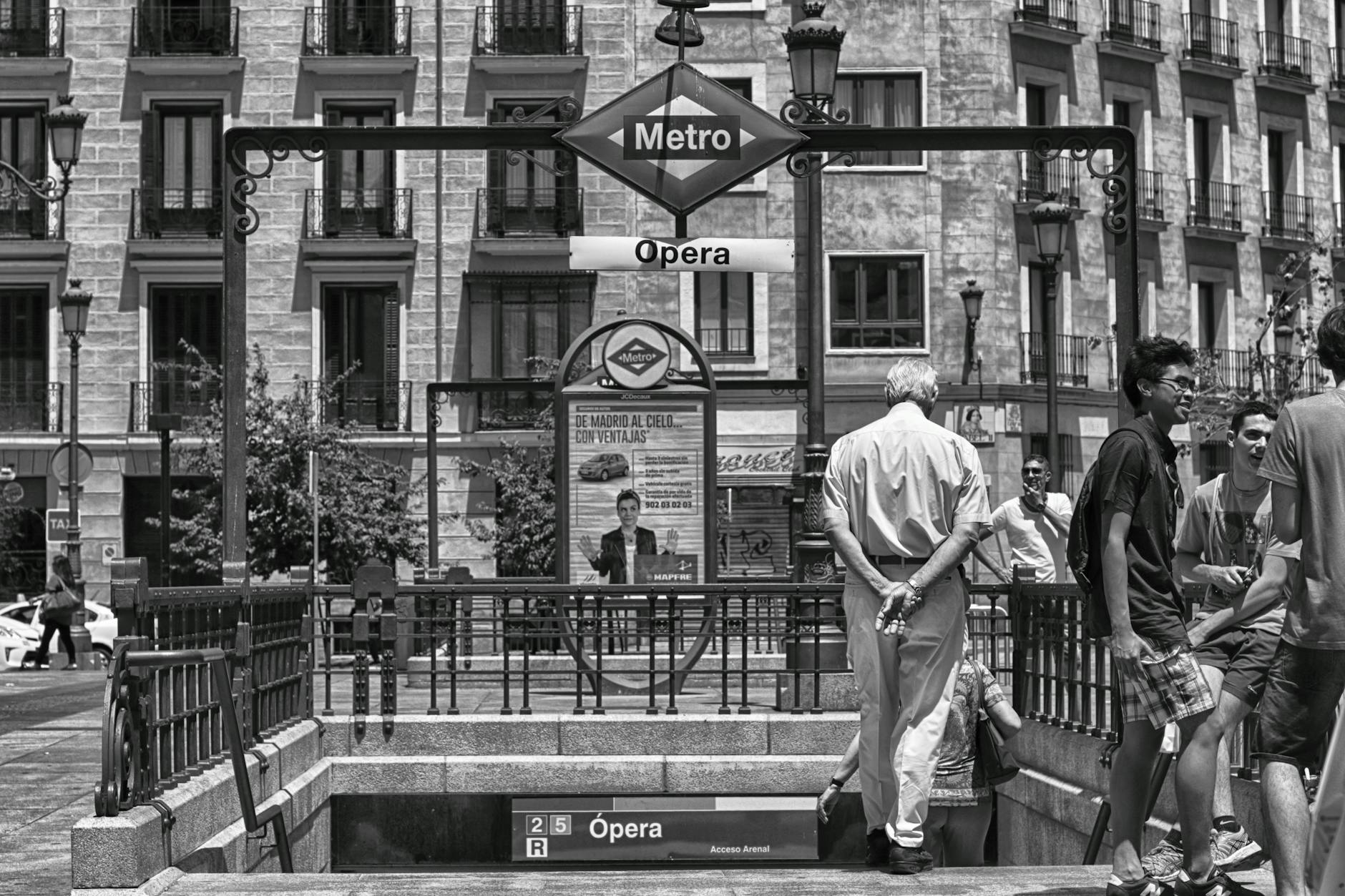 Opera Metro station entrance in Madrid with pedestrians