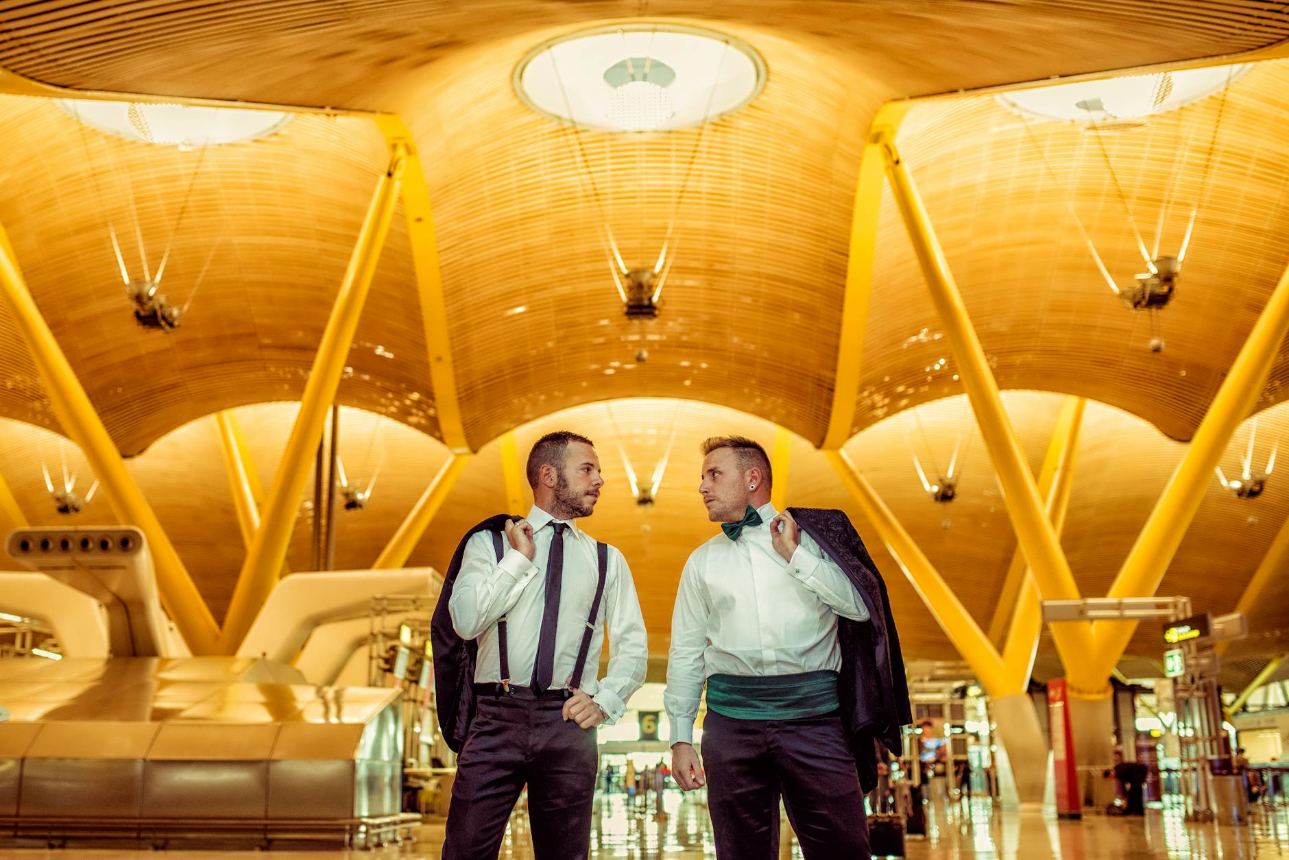 Business travelers in formal attire inside Madrid Barajas Airport