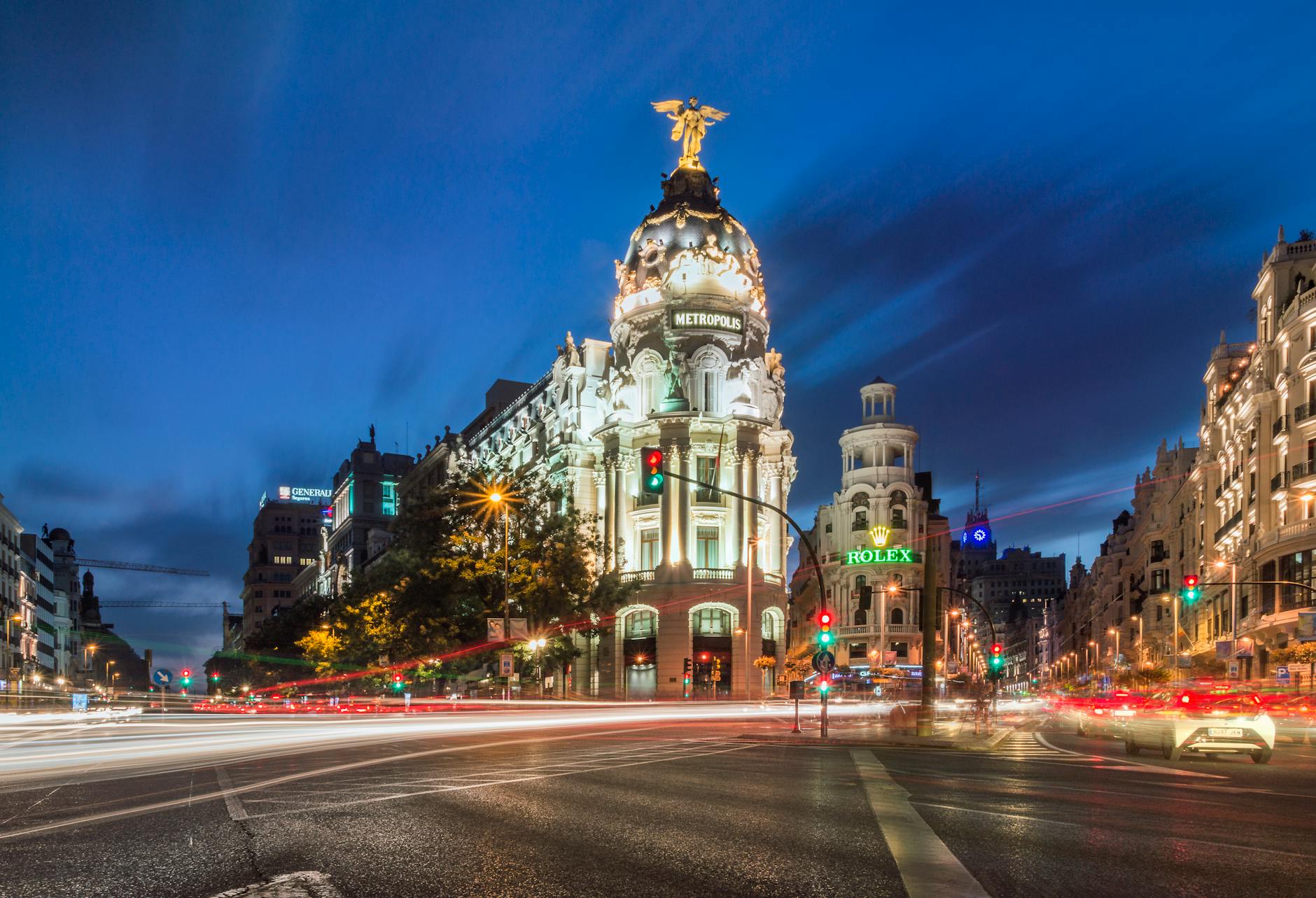 Metropolis Building and traffic light trails in Madrid at night