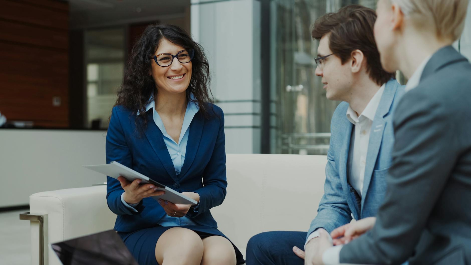 Professionals discussing business strategy in a modern office