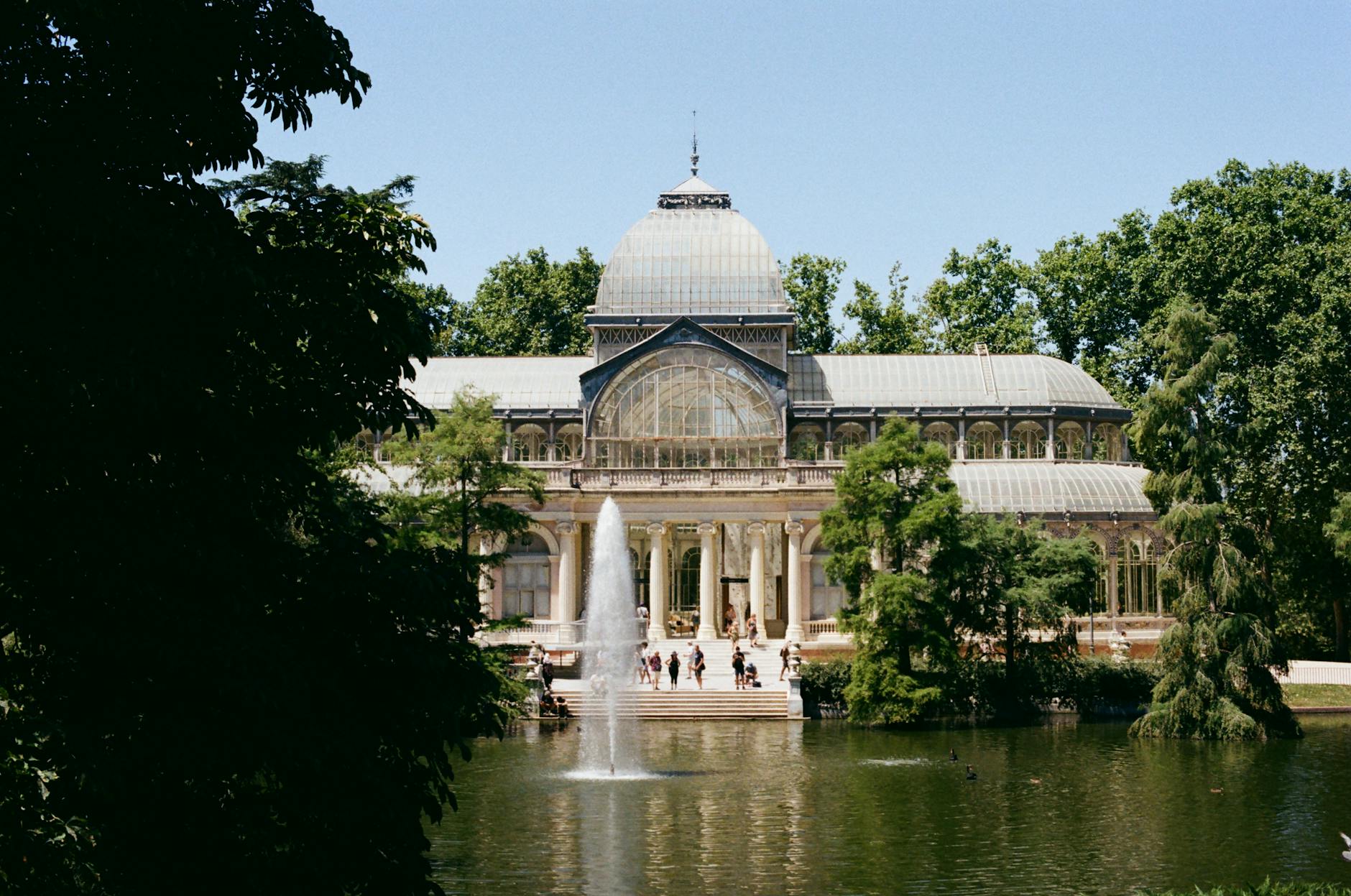 Crystal Palace in Retiro Park surrounded by trees