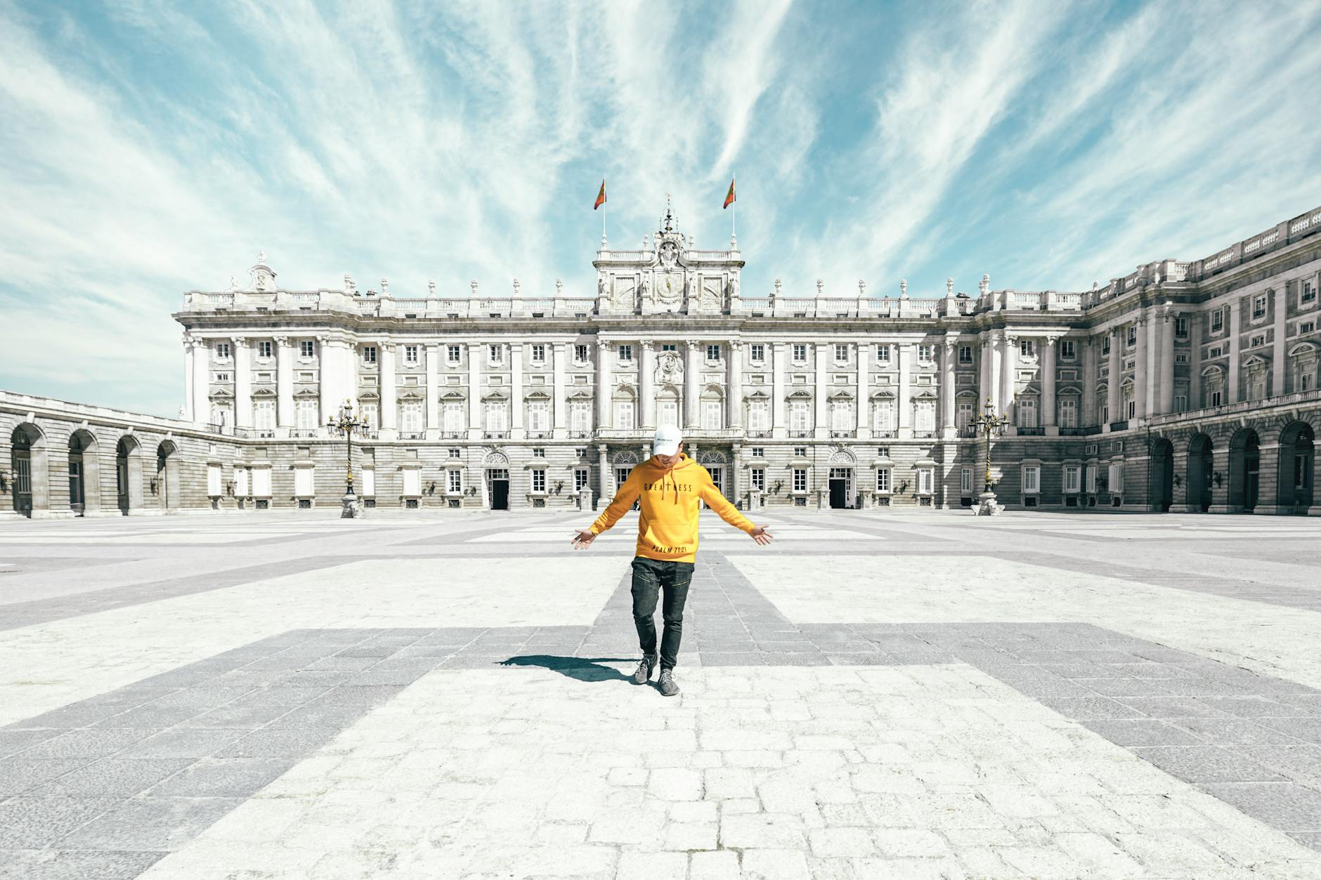 Traveler standing near the Royal Palace of Madrid