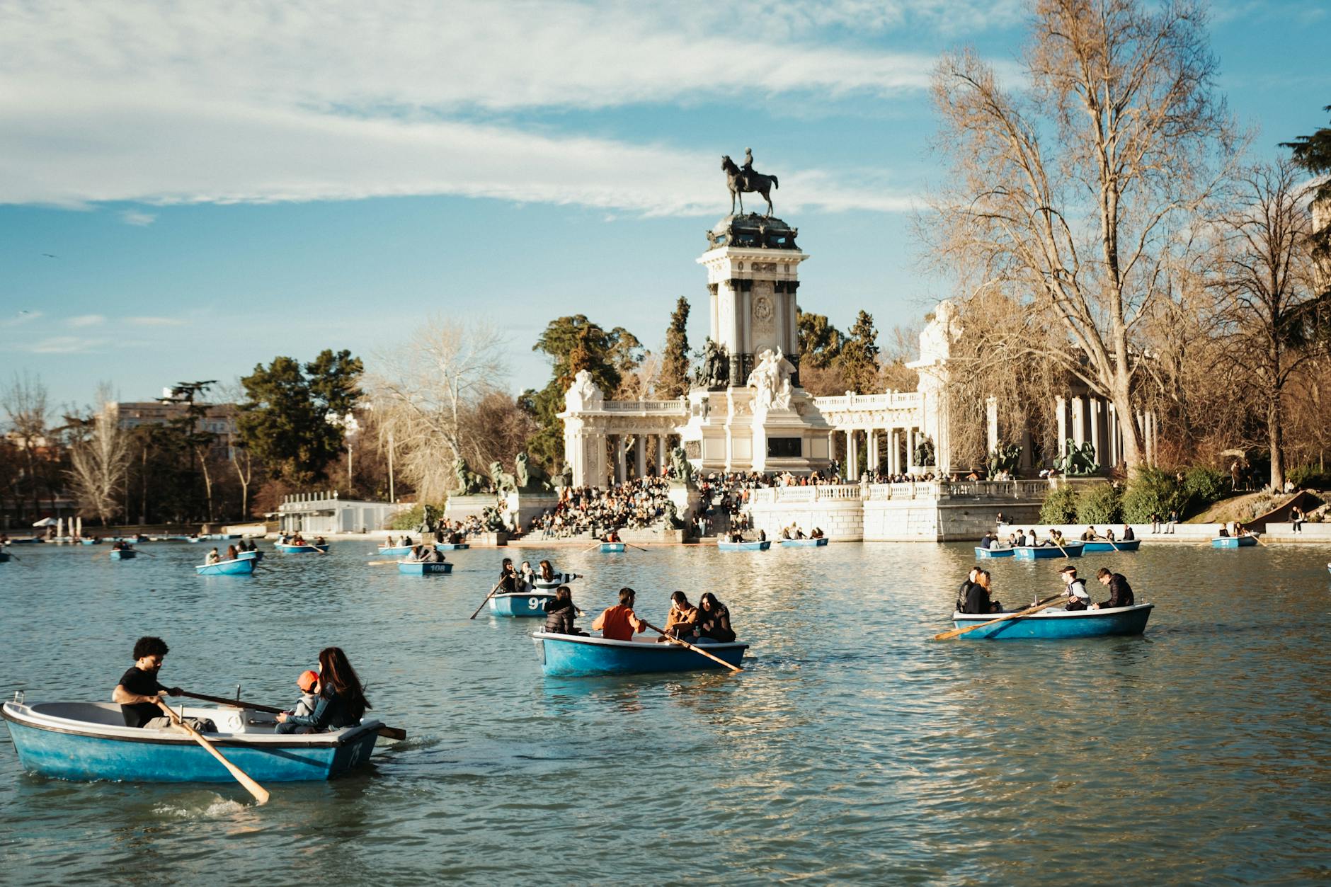 People boating on the lake in Retiro Park in Madrid