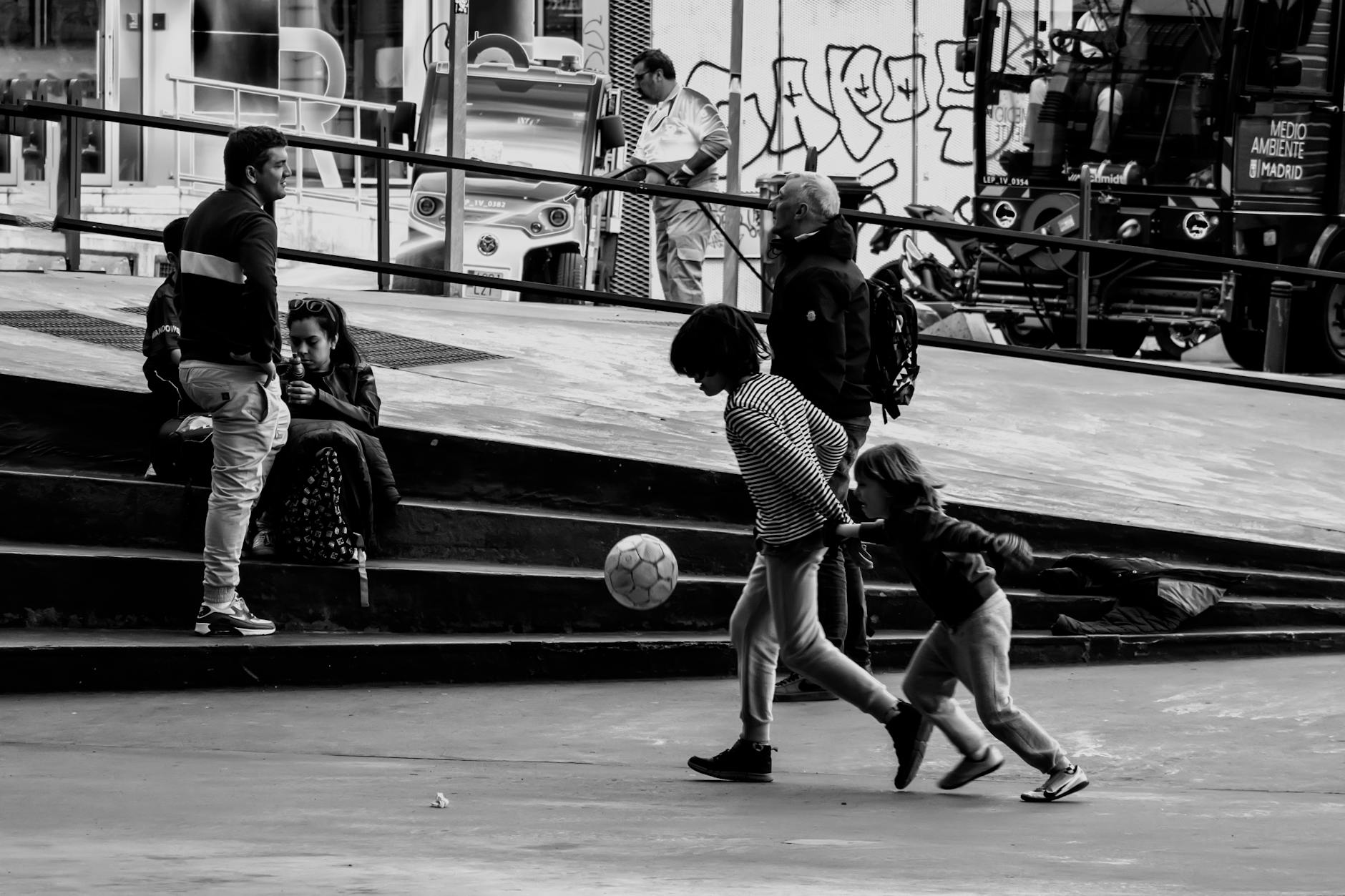 Children playing soccer in a Madrid skate park