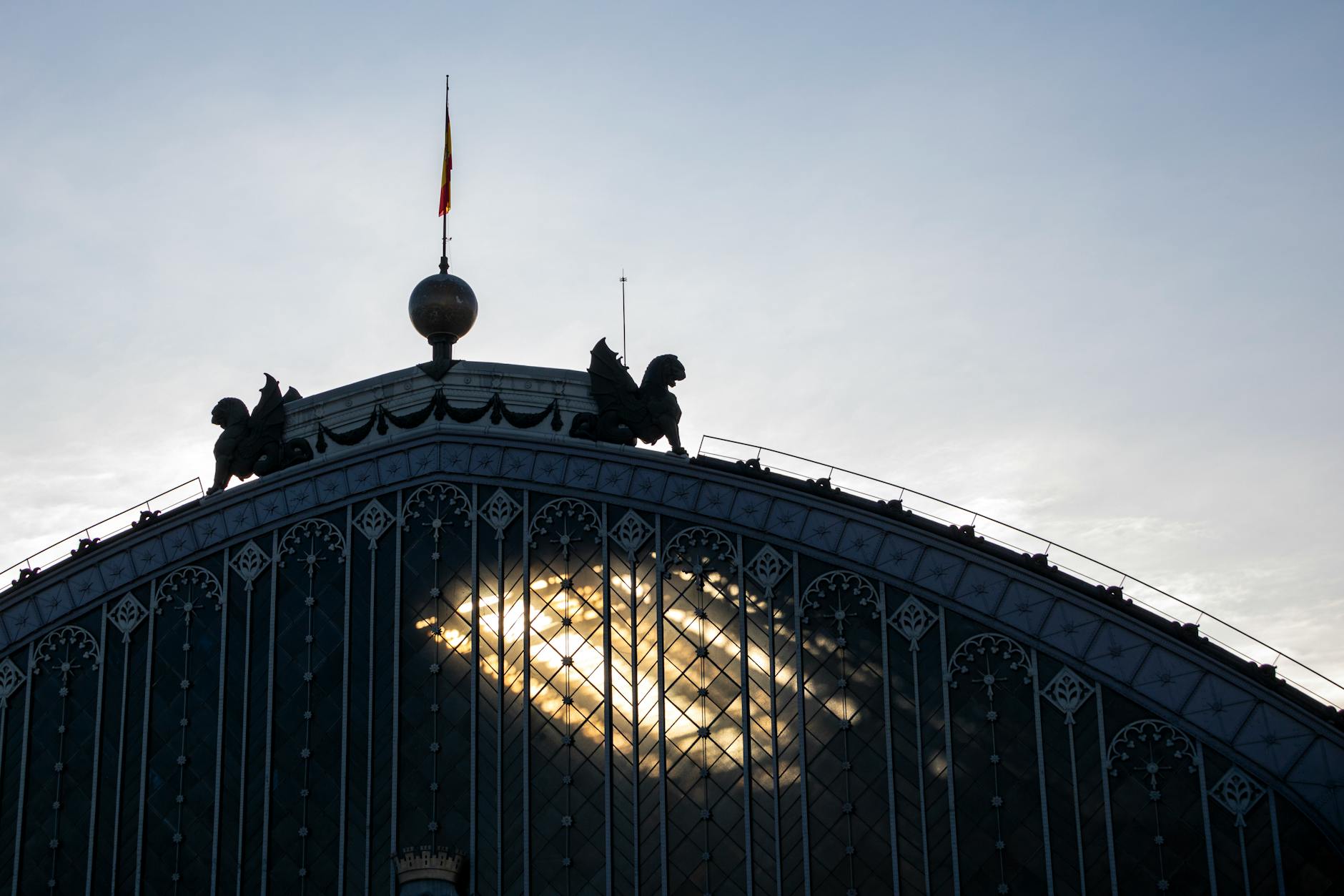 Atocha Station roof silhouette in Madrid with sunlight through the structure