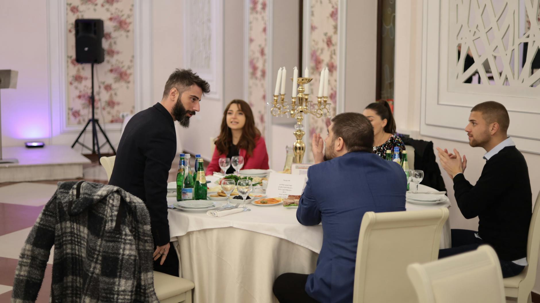 Elegant indoor dinner gathering with business conversation