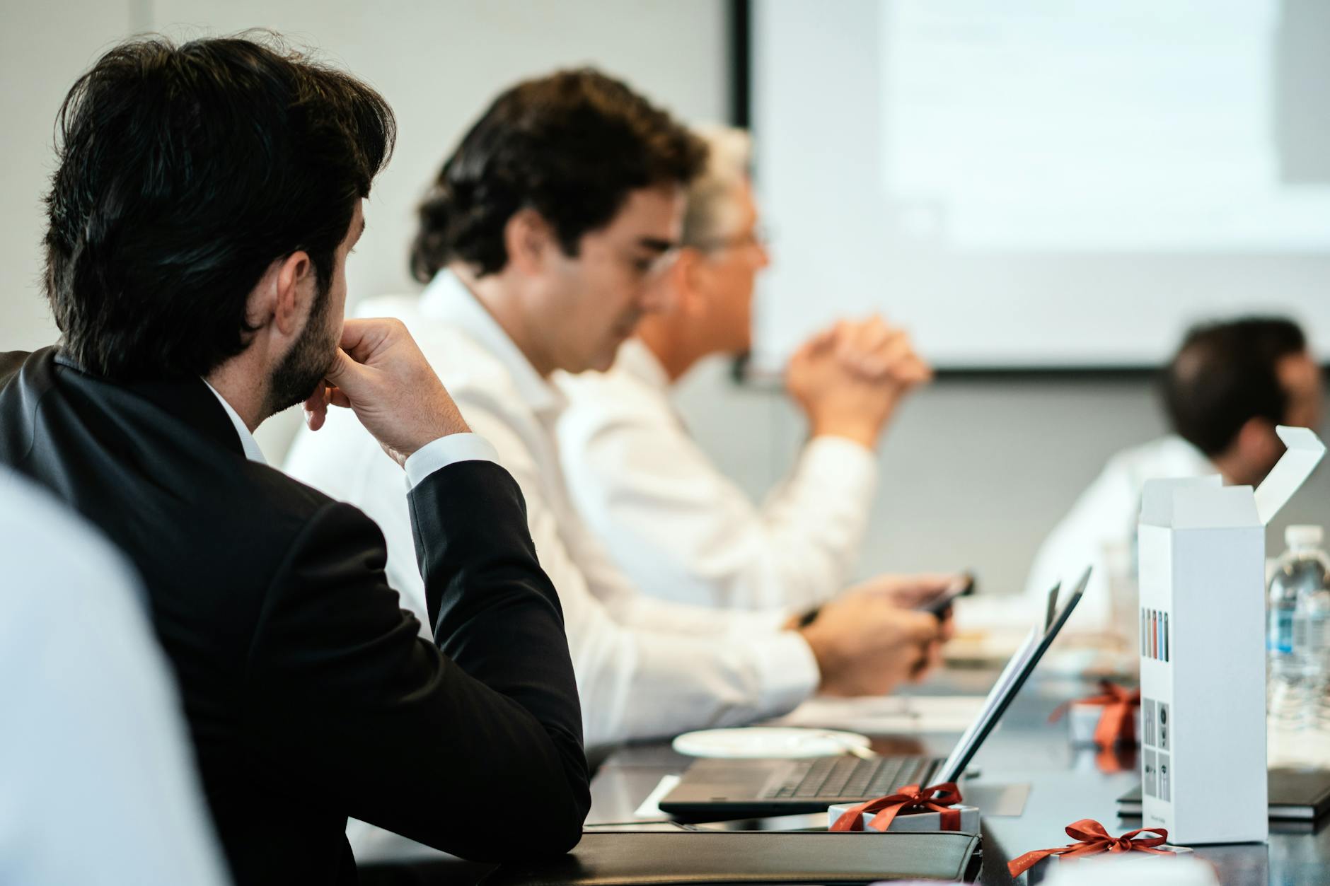 Corporate professionals in a formal meeting environment
