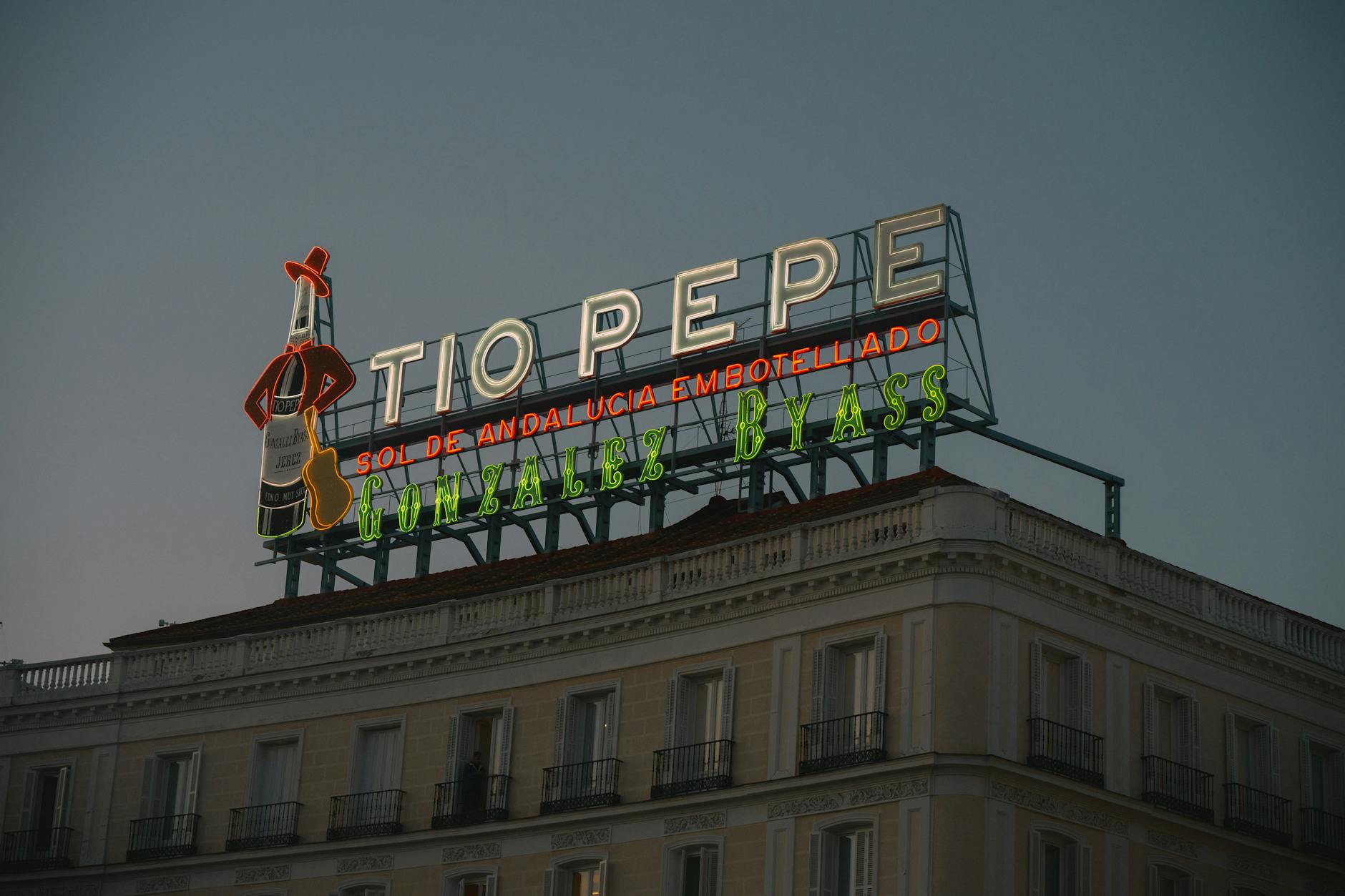 Tio Pepe sign glowing at dusk in Puerta del Sol