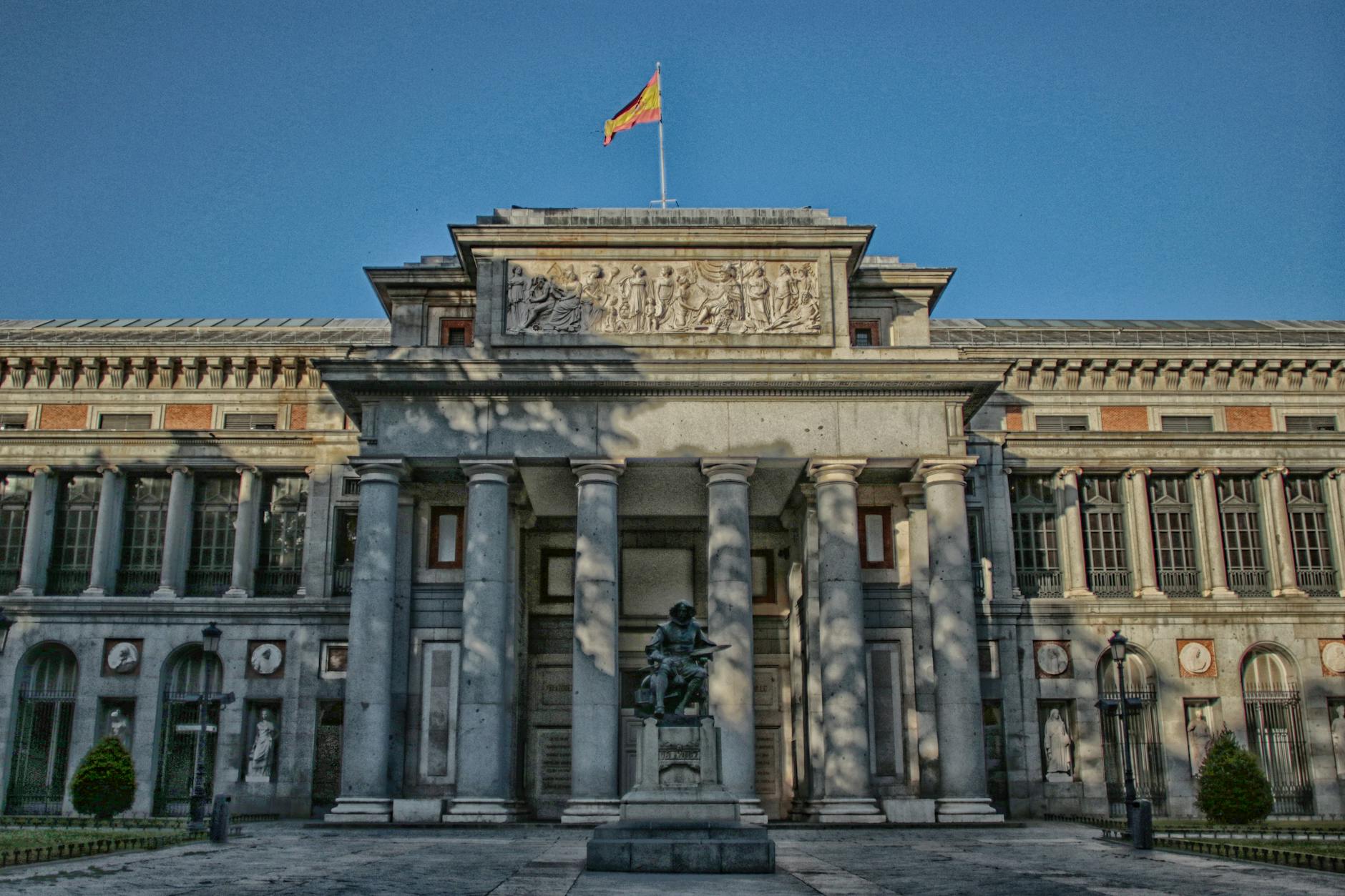 Exterior of the Prado Museum in Madrid with a statue in front