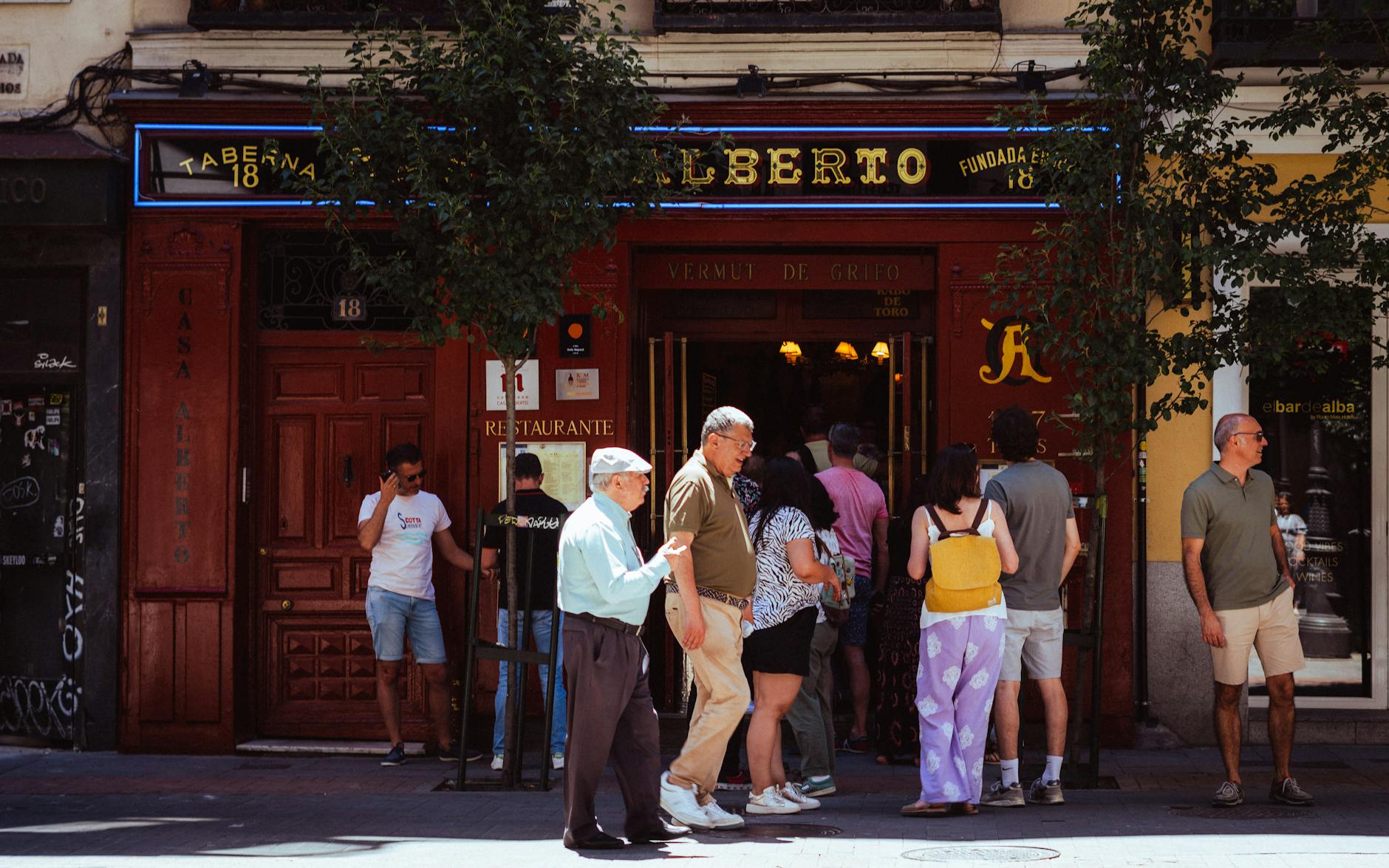 People gathered outside Taberna Alberto in Madrid