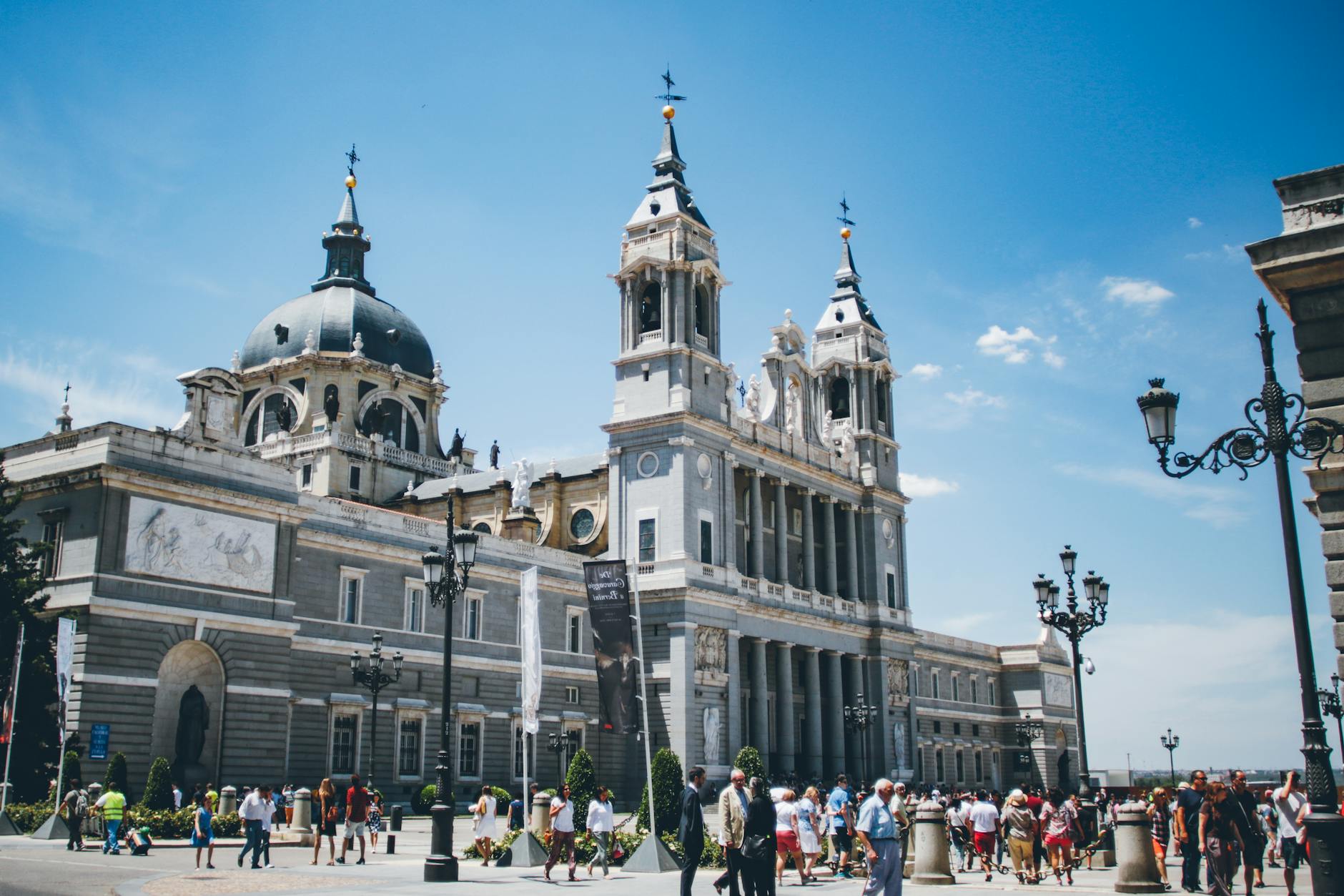 Visitors outside Almudena Cathedral in Madrid