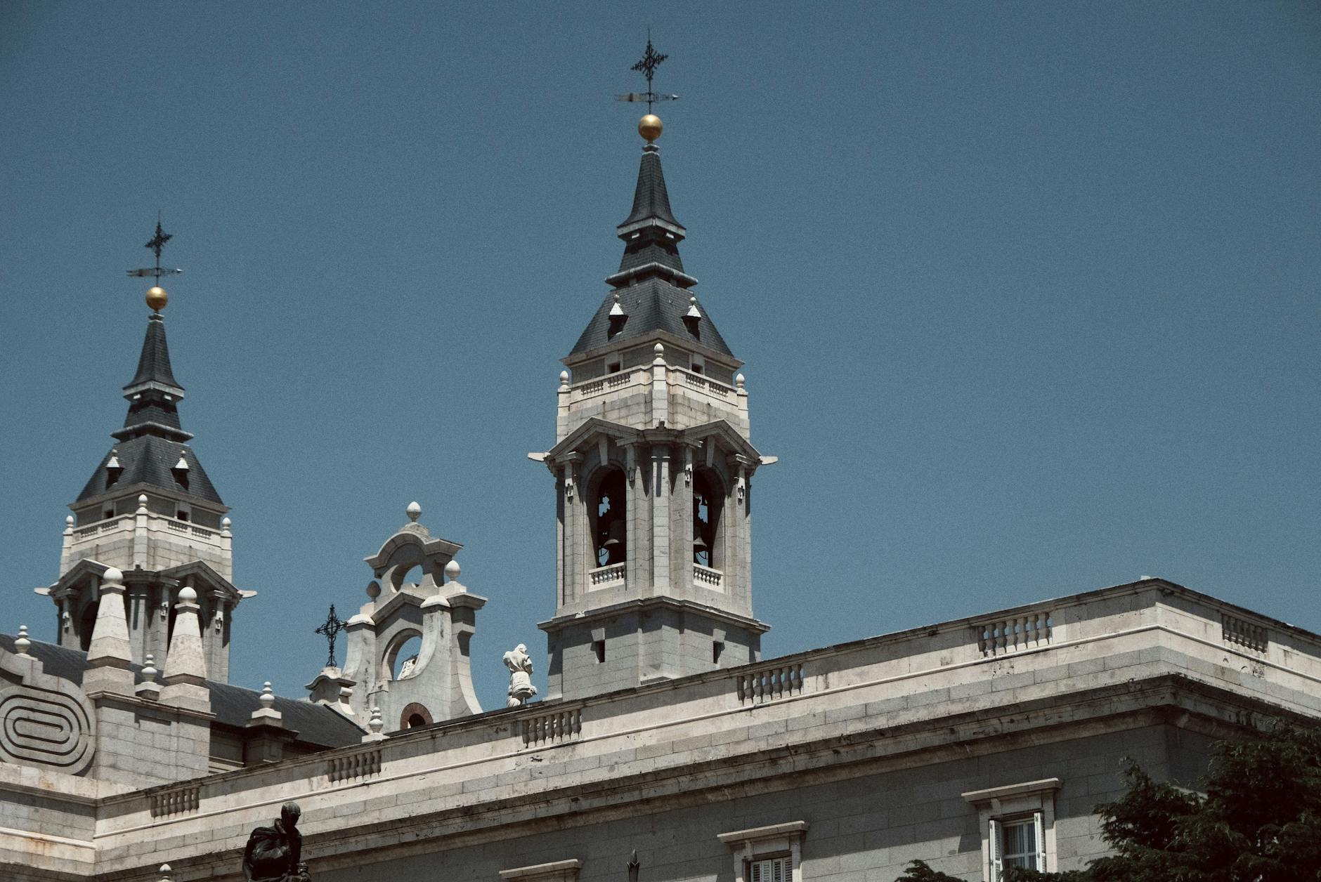 Historic cathedral spires in Madrid against a blue sky