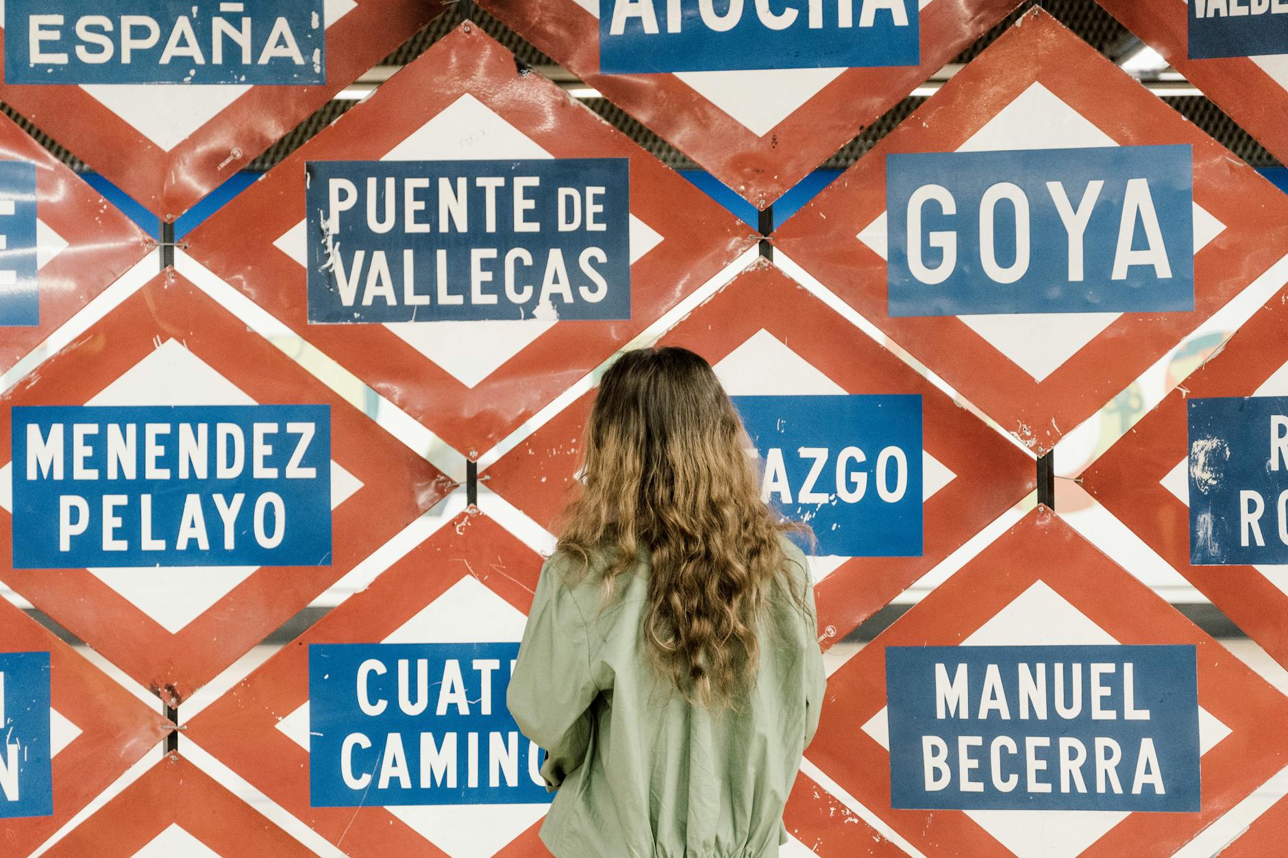 Woman reading transit signs in Madrid